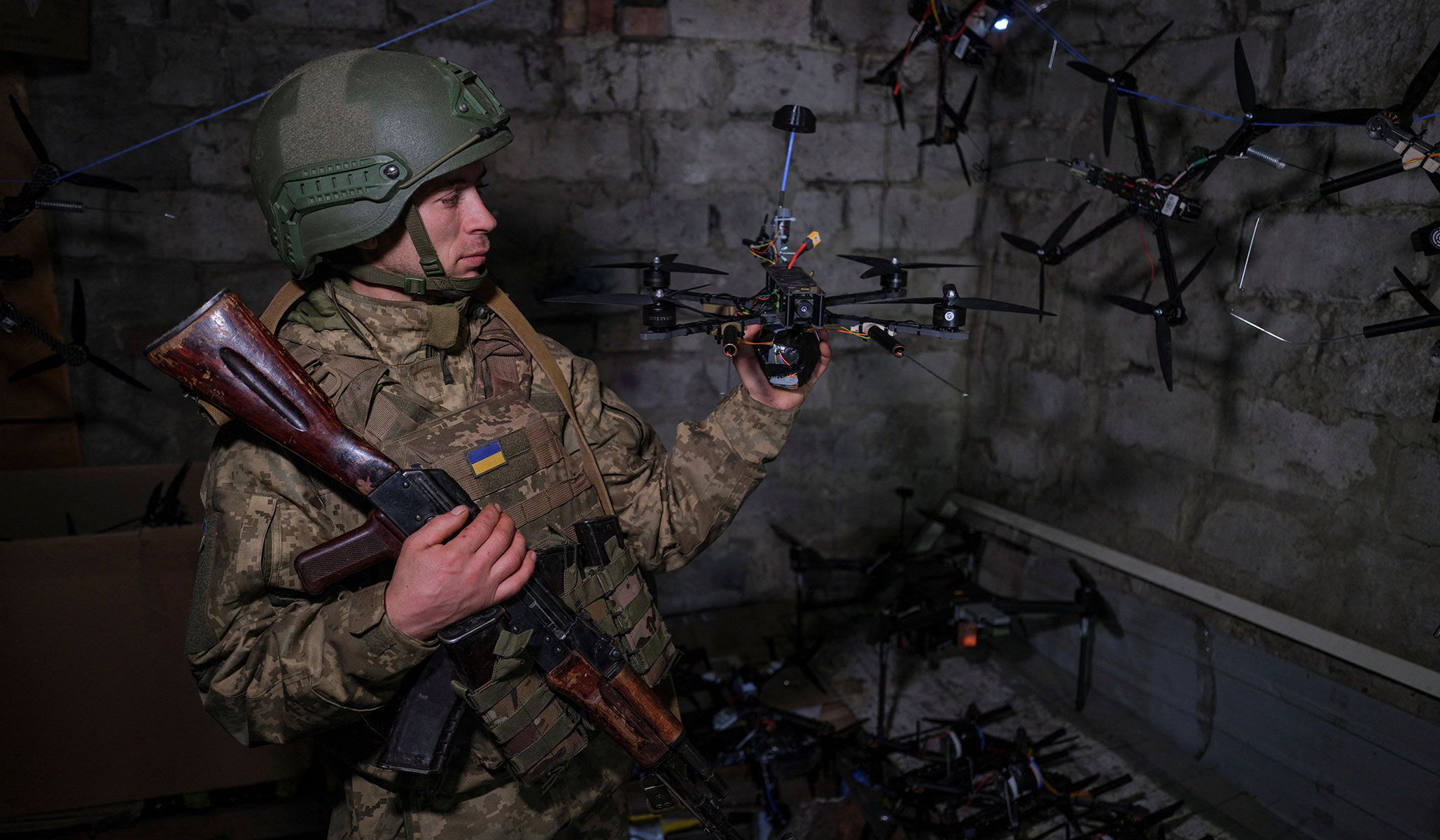 A service member of the 93rd Kholodnyi Yar Separate Mechanized Brigade of the Ukrainian Armed Forces shows a ready-to-fly FPV-drone at a position on outskirts of the frontline town of Druzhkivka, Donetsk Region, Ukraine, April 7, 2026.