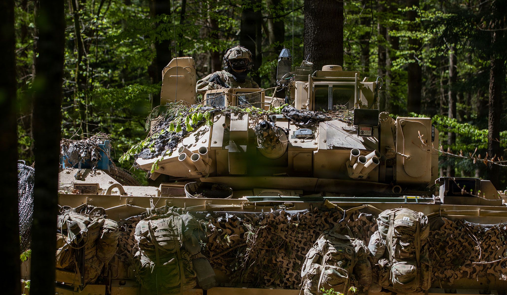 A U.S. Army M2A3 Bradley Fighting Vehicle manned by engineers of First Platoon “Black Sheep,” Alpha Company, Third Brigade Engineer Battalion, provides overwatch during a shape and charge mission at the Hohenfels Training Area, Germany, April 25, 2026.
