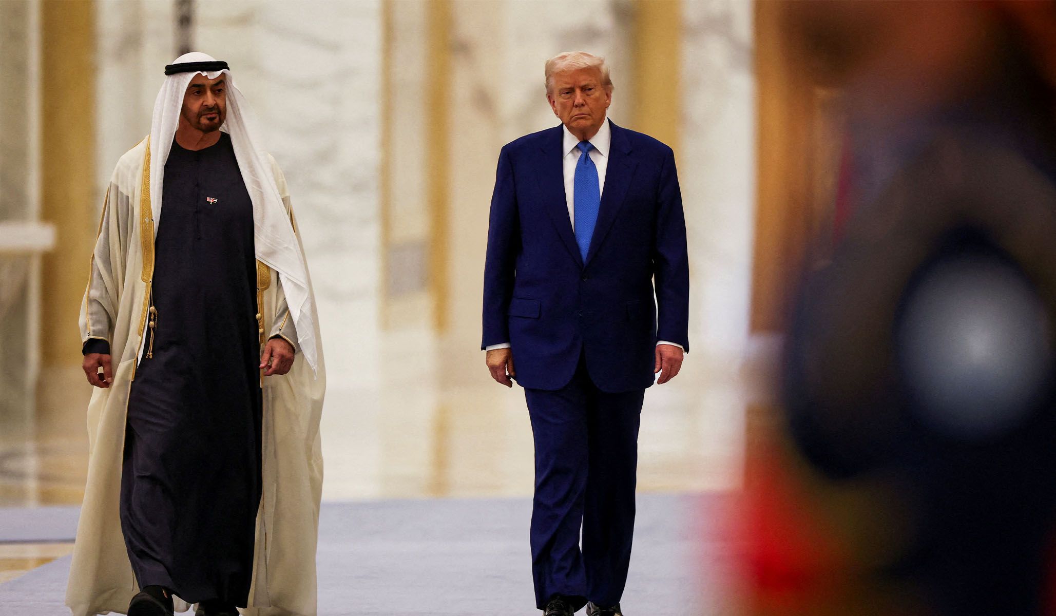 President Donald Trump walks with UAE President Sheikh Mohamed bin Zayed Al Nahyan in Abu Dhabi, May 15, 2025.