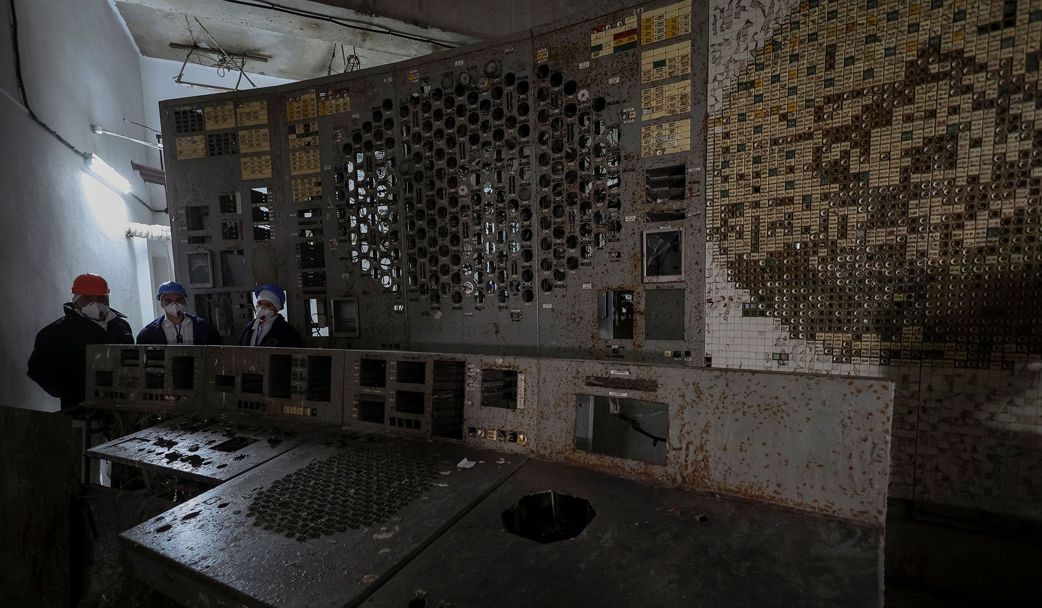 Employees visit a control center of the damaged fourth reactor at the Chernobyl nuclear power plant in Kyiv Region, Ukraine, April 22, 2026.