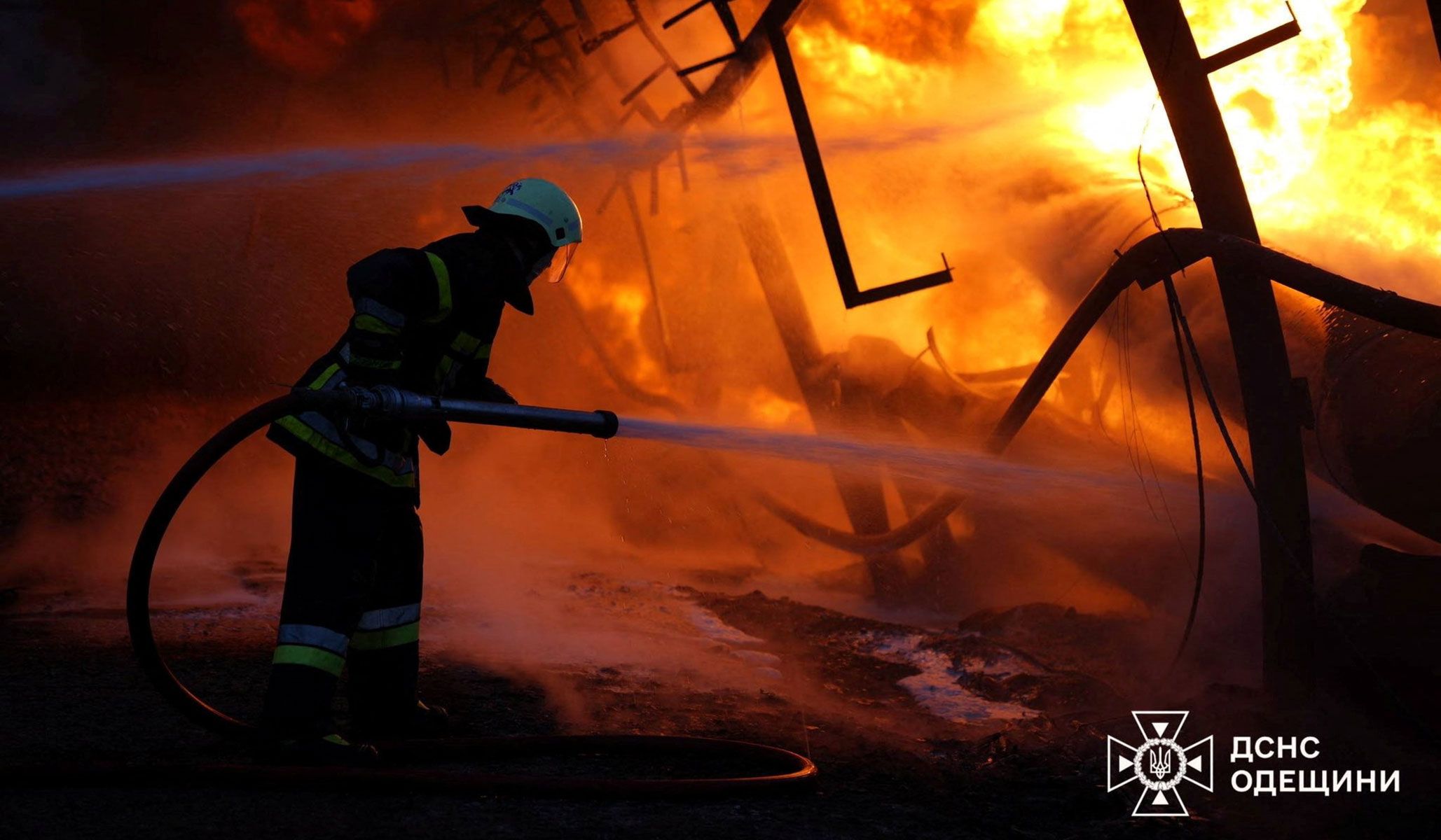 A firefighter works at a critical infrastructure facility hit by Russian drone strikes in Odesa Region, Ukraine, April 10, 2026.