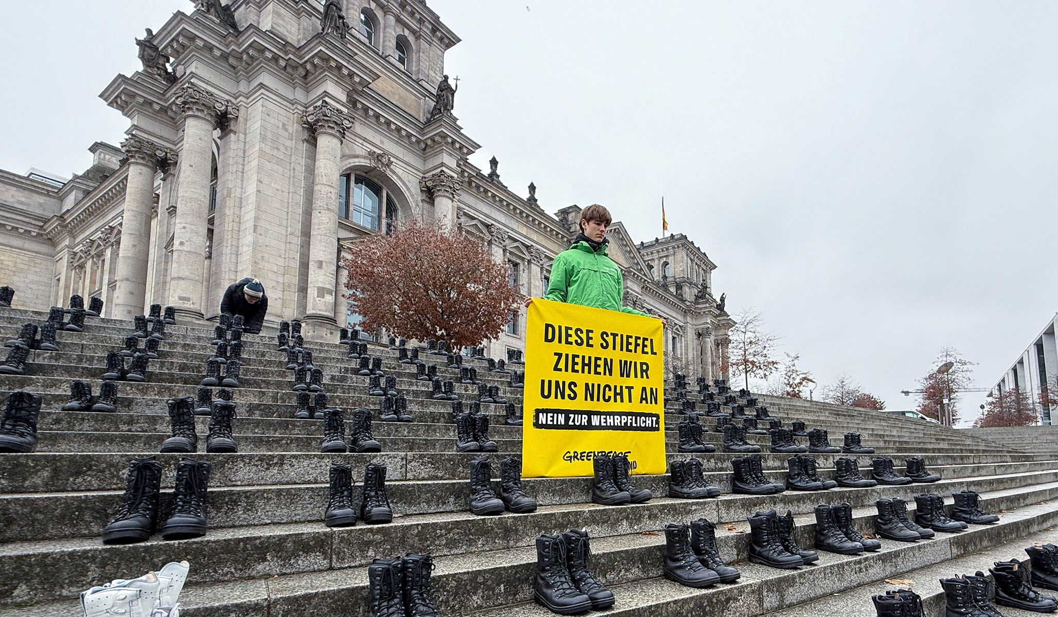 Army boots line the steps of the Reichstag Building during a youth protest in Berlin, Germany, November 10, 2025.