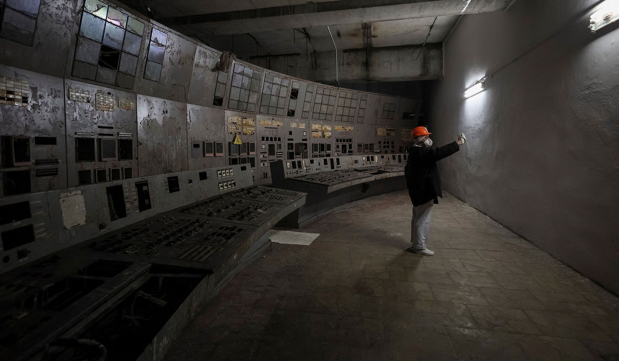 A journalist takes a selfie as he visits a control center of the damaged fourth reactor at the Chernobyl nuclear power plant in Kyiv Region, Ukraine, April 22, 2026.