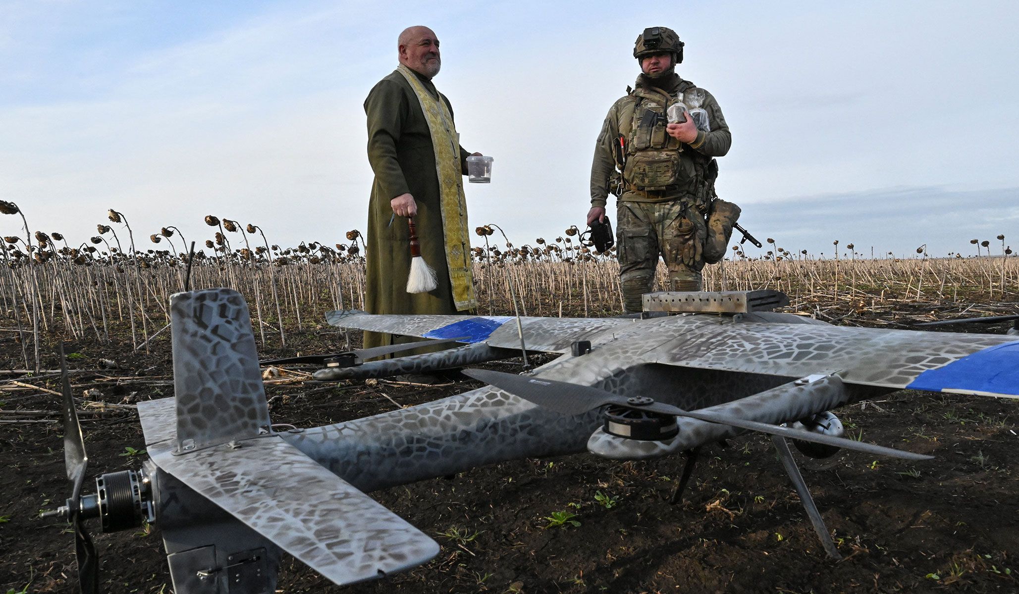 Orthodox chaplain Stepan sprinkles holy water on a Gara combat drone as he visits a position of members of the National Police Special Purpose Battalion Zaporizhzhia Region near a front line ahead of Orthodox Easter celebration in Zaporizhzhia Region, Ukraine, April 8, 2026.