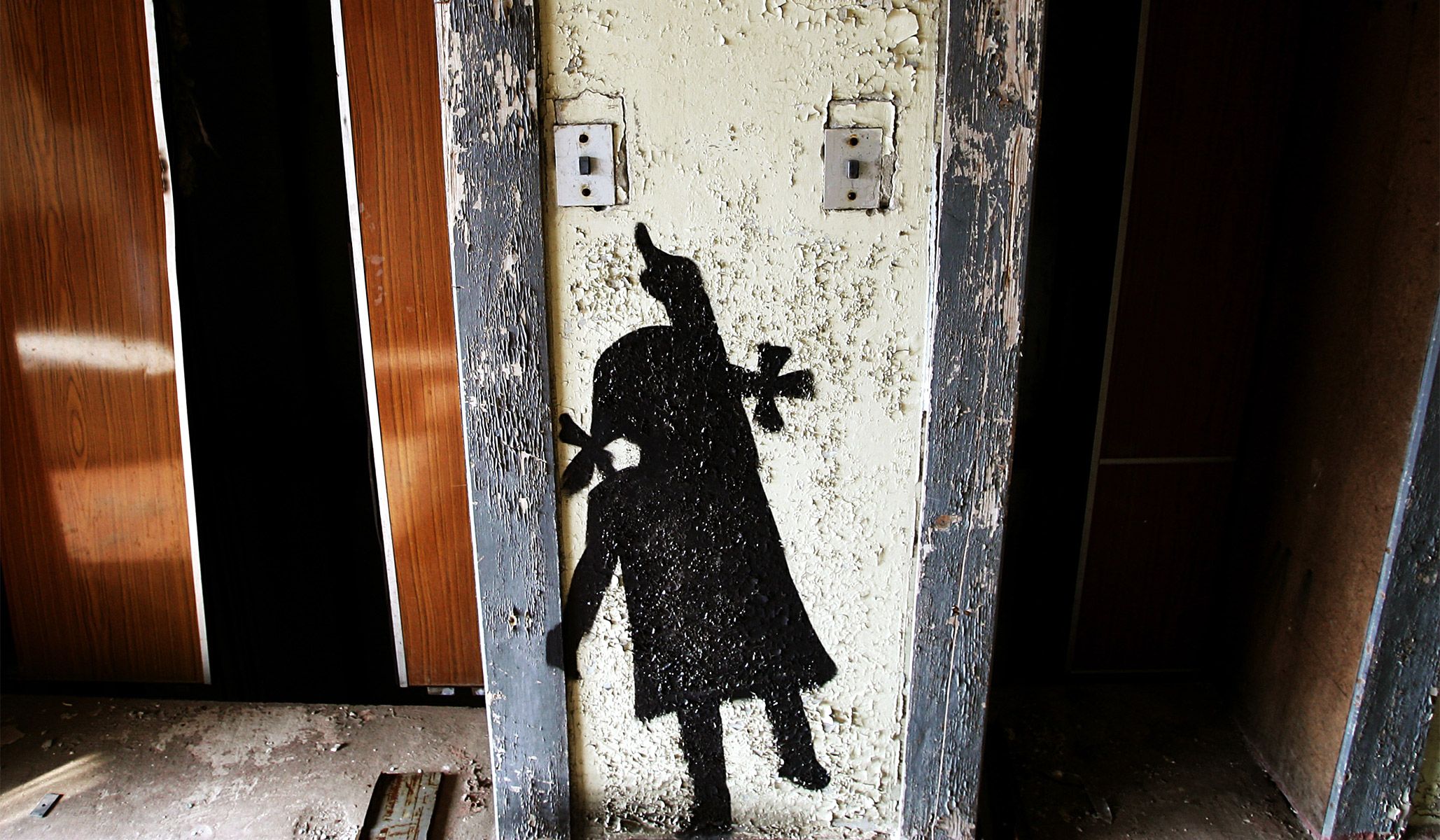 Graffiti of a girl an empty building in the abandoned town of Pripyat near the Chernobyl nuclear power plant in Ukraine, March 31, 2006.