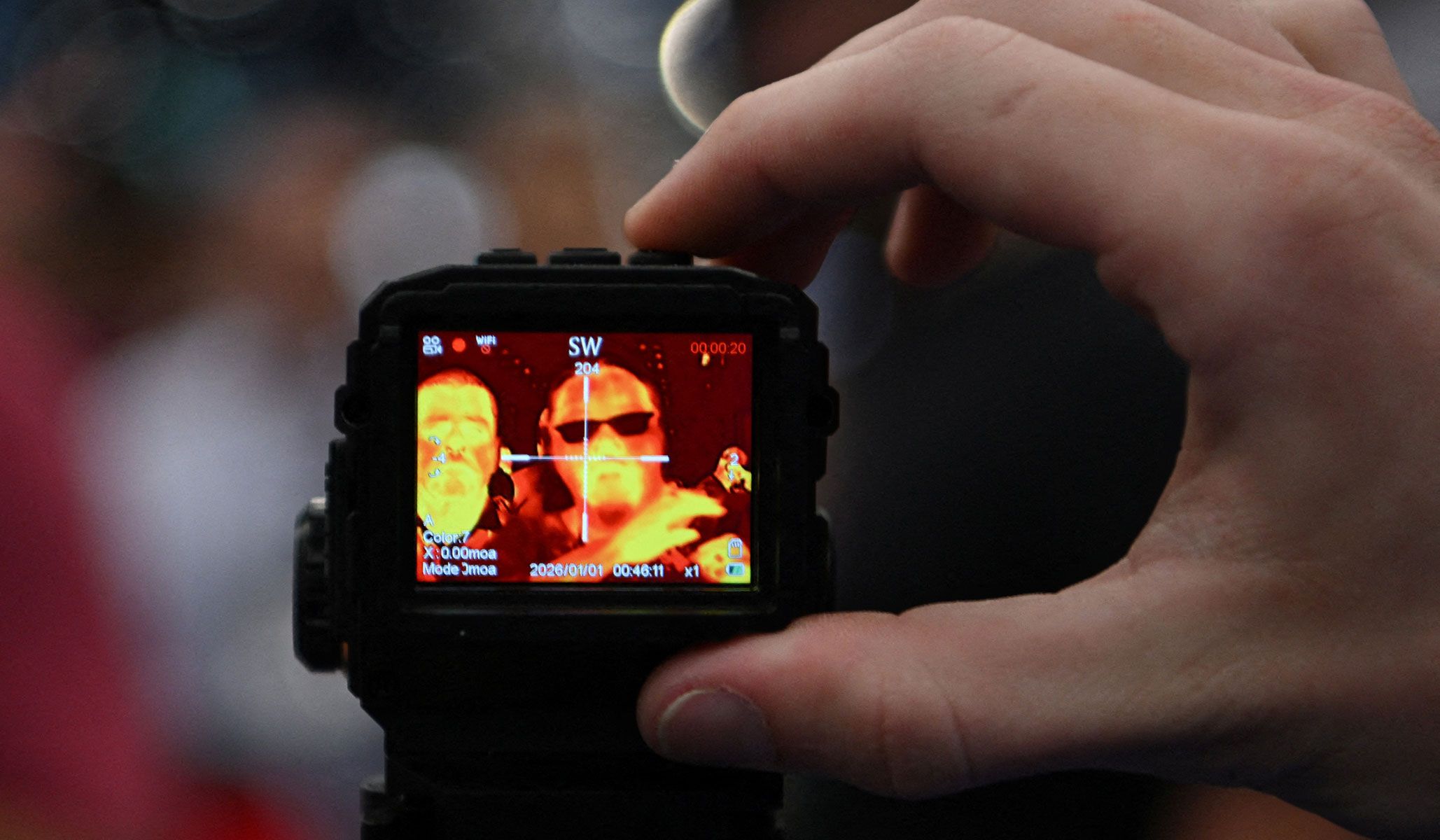 A person uses a thermal camera on display during the National Rifle Association's annual meetings and exhibits in Houston, Texas, April 17, 2026.