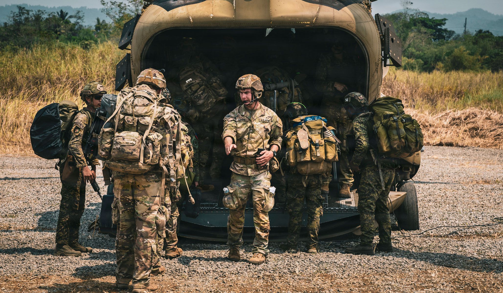 A U.S. Army soldier counts U.S. and Philippine Army soldiers as they enter a U.S. Army CH-47 Chinook assigned to Task force Saber, 25th Combat Aviation Brigade, 25th Infantry Division, during a long range maritime air assault as part of Exercise Balikatan 2026 at Cagayan North International Airport in Lal-Lo, Philippines, April 23, 2026.