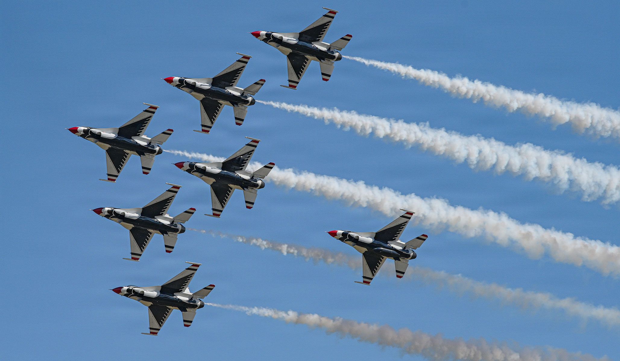 U.S. Air Force Major Samuel Larson, Thunderbirds 8/Advance pilot and narrator, assigned to the Air Demonstration Squadron "Thunderbirds," and Captain Francisco Trujillo, Fairfield Fire Department firefighter paramedic and SWAT tactical medic, fly behind the Delta Formation during an incentive flight at Travis Air Force Base, Calif., April 24, 2026.
