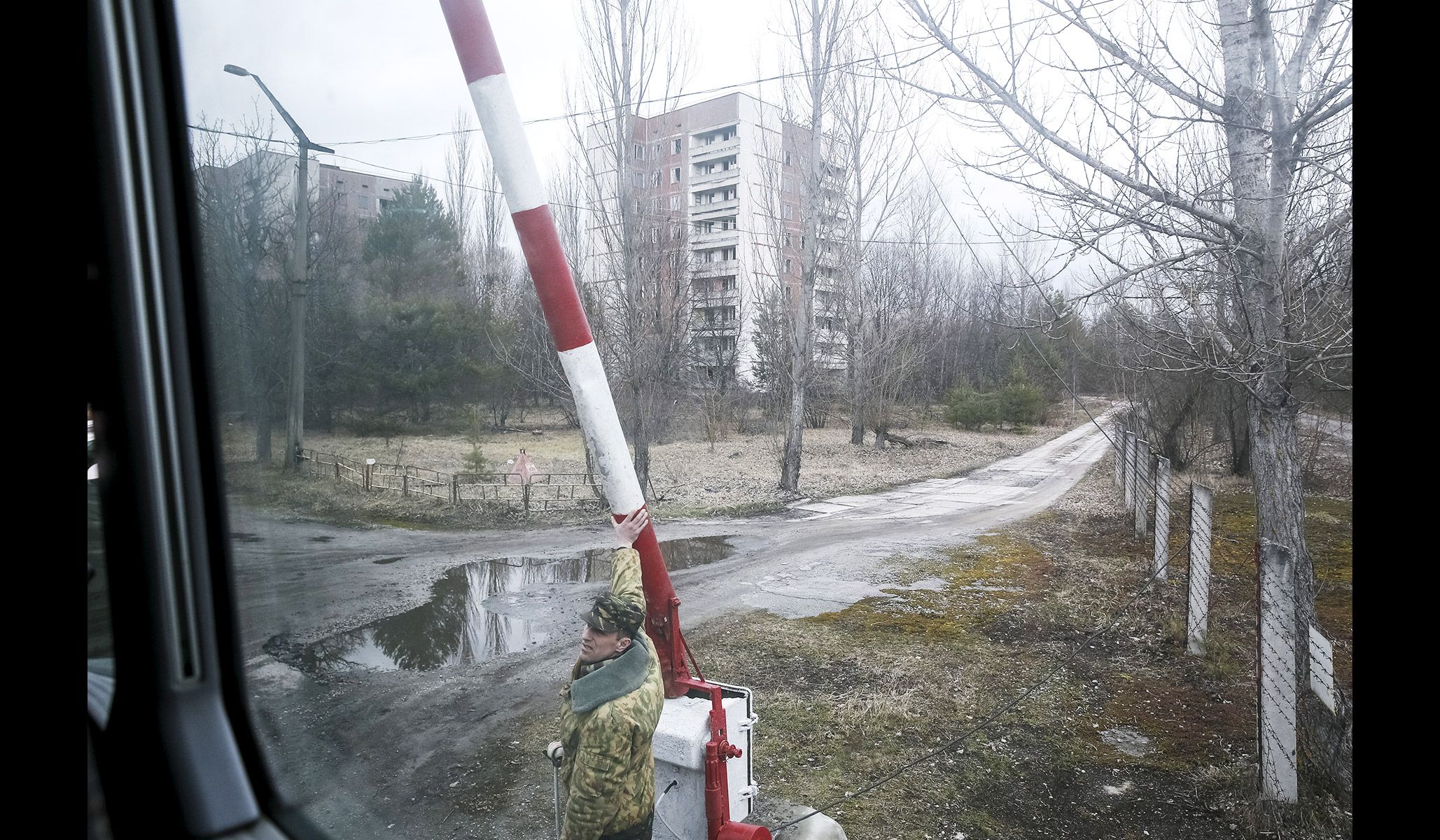 A guard at a checkpoint in the abandoned city of Pripyat near the Chernobyl nuclear power plant in Ukraine, March 23, 2016.