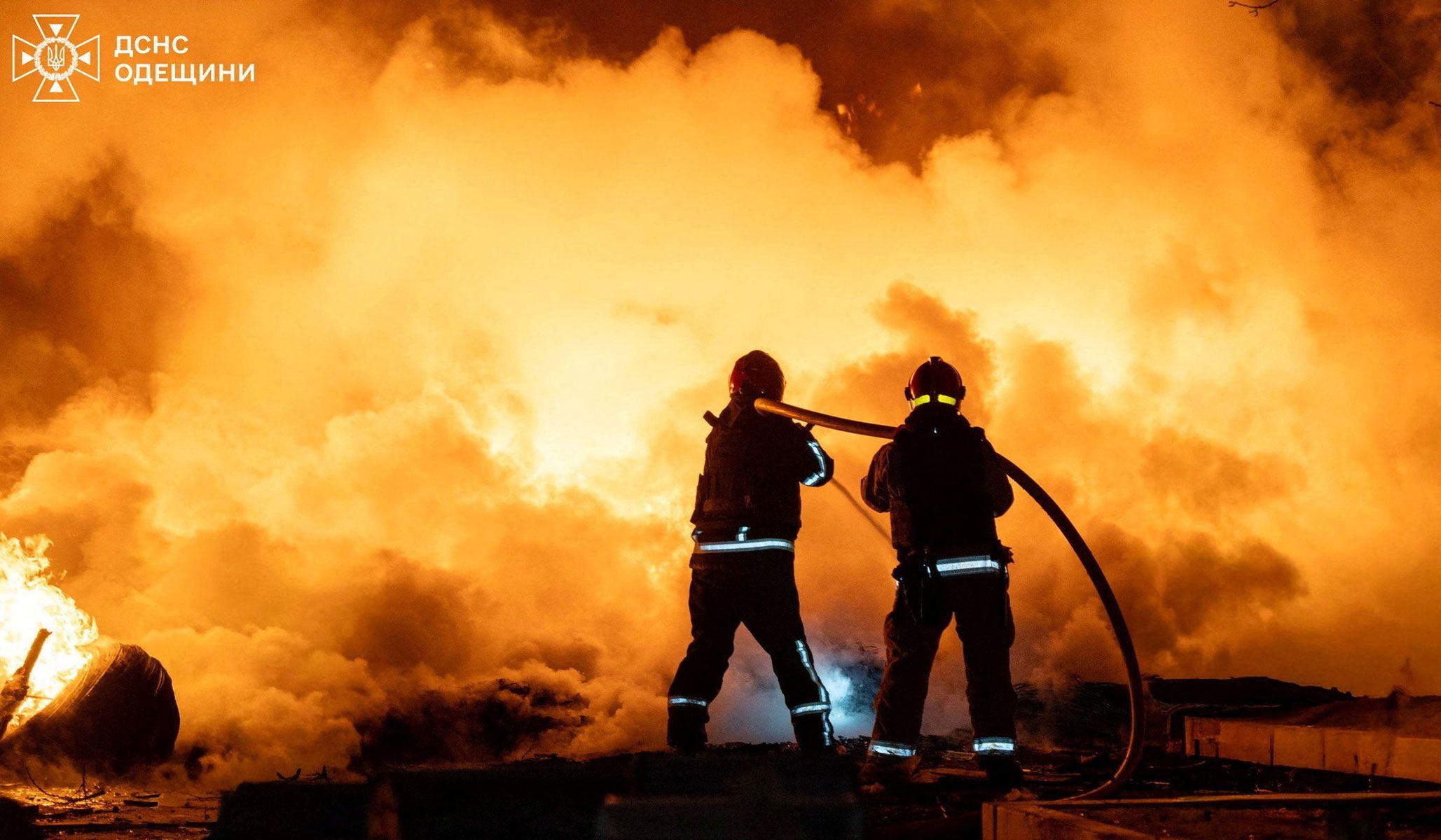 Firefighters work at the site of an overnight Russian drone strike in Odesa, Ukraine, April 11, 2026.