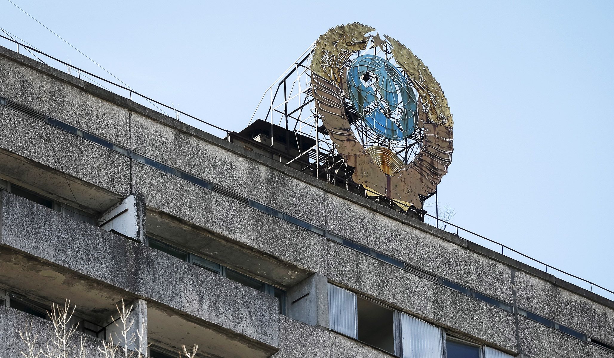 The coat of arms of the former Soviet Union on the top of a building in the abandoned city of Pripyat near Chernobyl nuclear power plant in Ukraine, March 28, 2016.