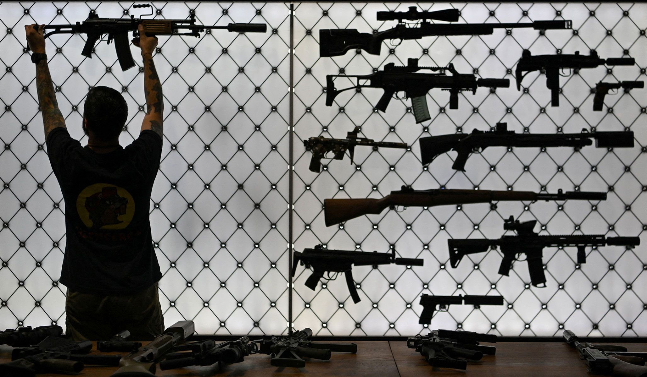 An exhibitor sets up a booth ahead of the National Rifle Association's annual meetings and exhibits in Houston, Texas, April 16, 2026.