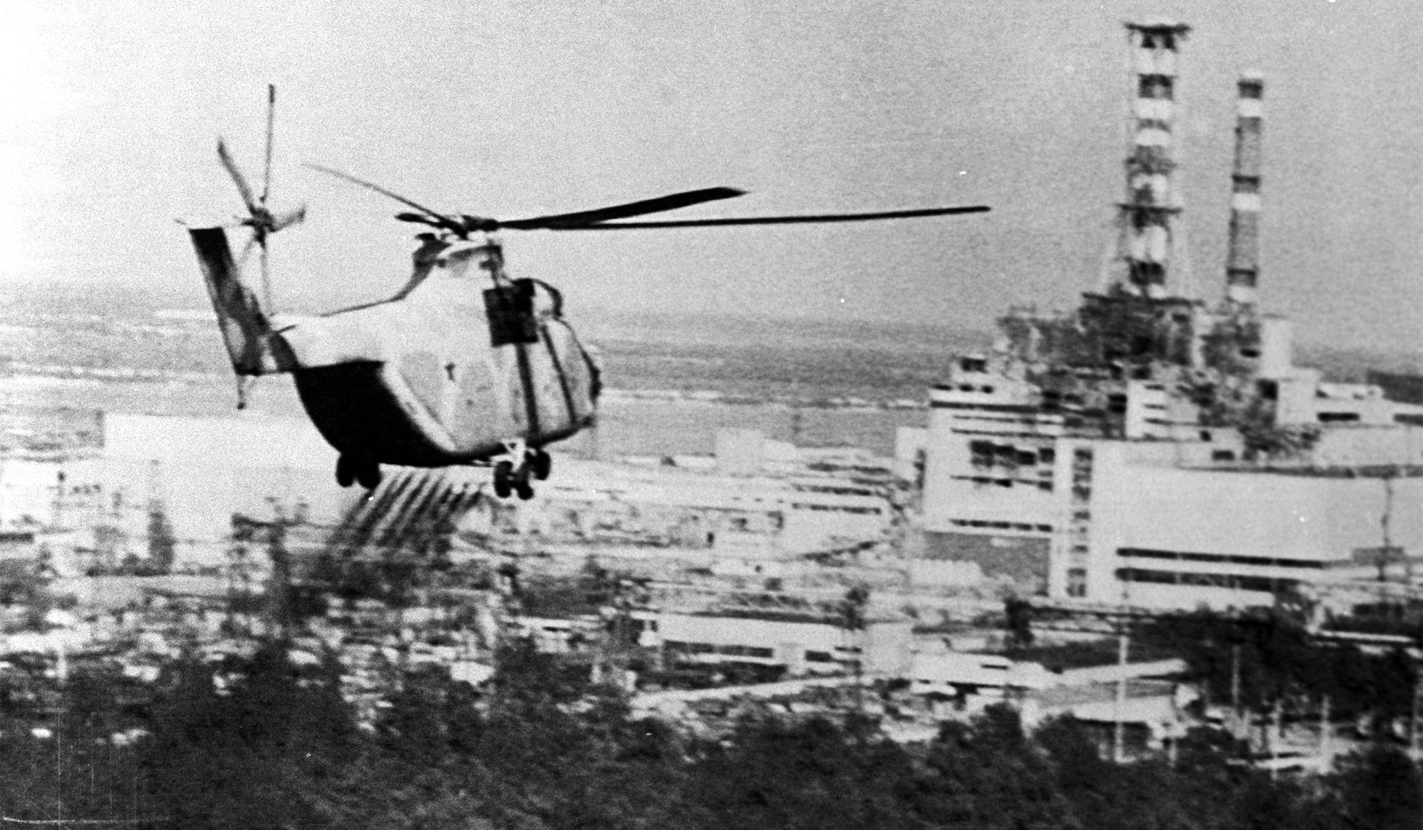 A helicopter sprays a decontaminating substance over the region surrounding the Chernobyl nuclear power plant, June 13, 1986.
