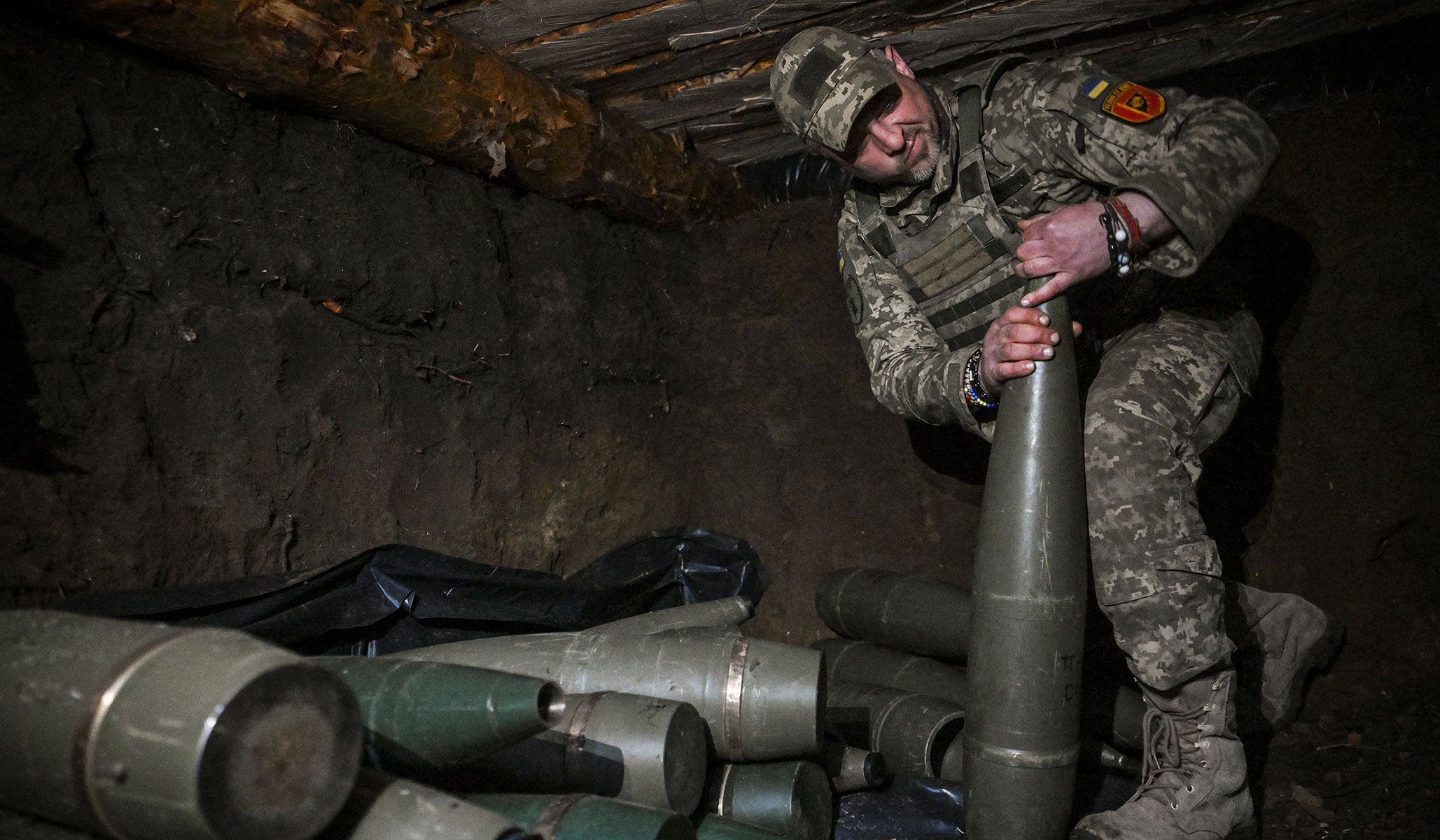 A Ukrainian serviceman of the 260th Zaporizhzhia Separate Territorial Defence Brigade of the Ukrainian Armed Forces checks a 152-mm shell for a D‑20 howitzer before firing towards Russian troops at a frontline position in Zaporizhzhia Region, Ukraine, April 9, 2026.