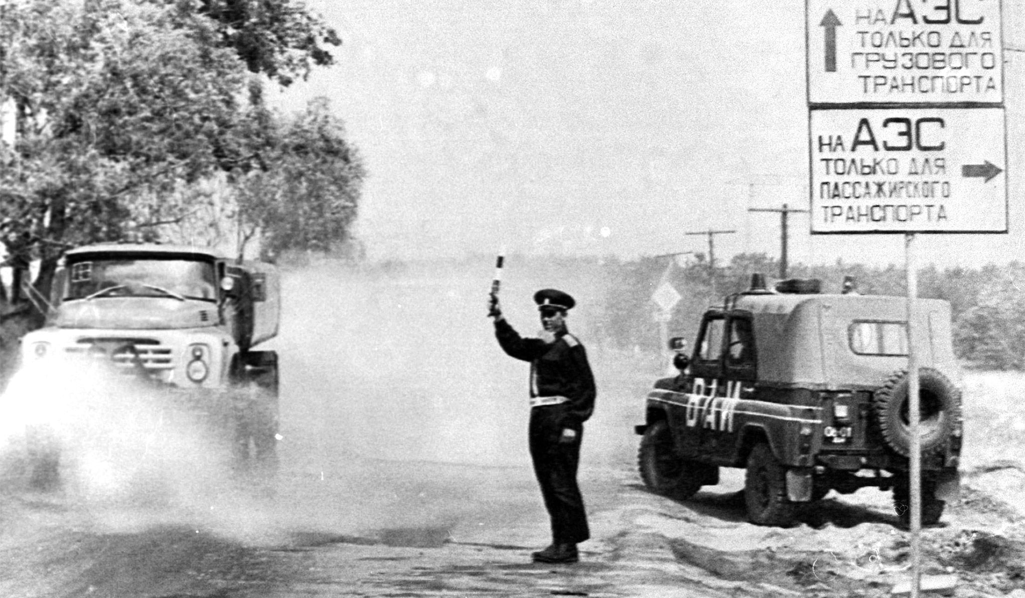 A traffic policeman checks vehicles entering the restricted zone surrounding the Chernobyl nuclear power plant in Ukraine, June 13, 1986.