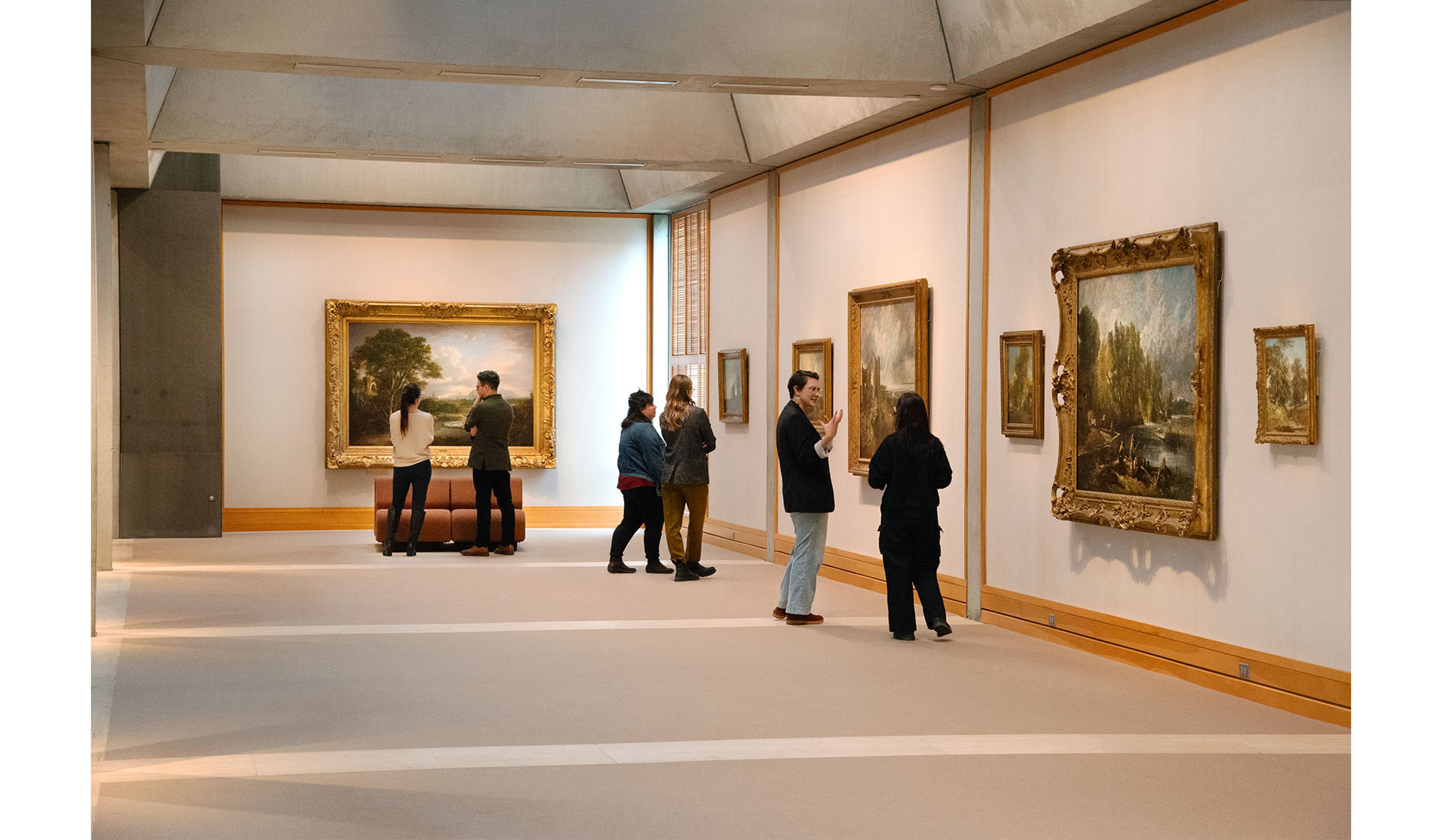 Visitors admire artwork in one of the galleries at the museum.