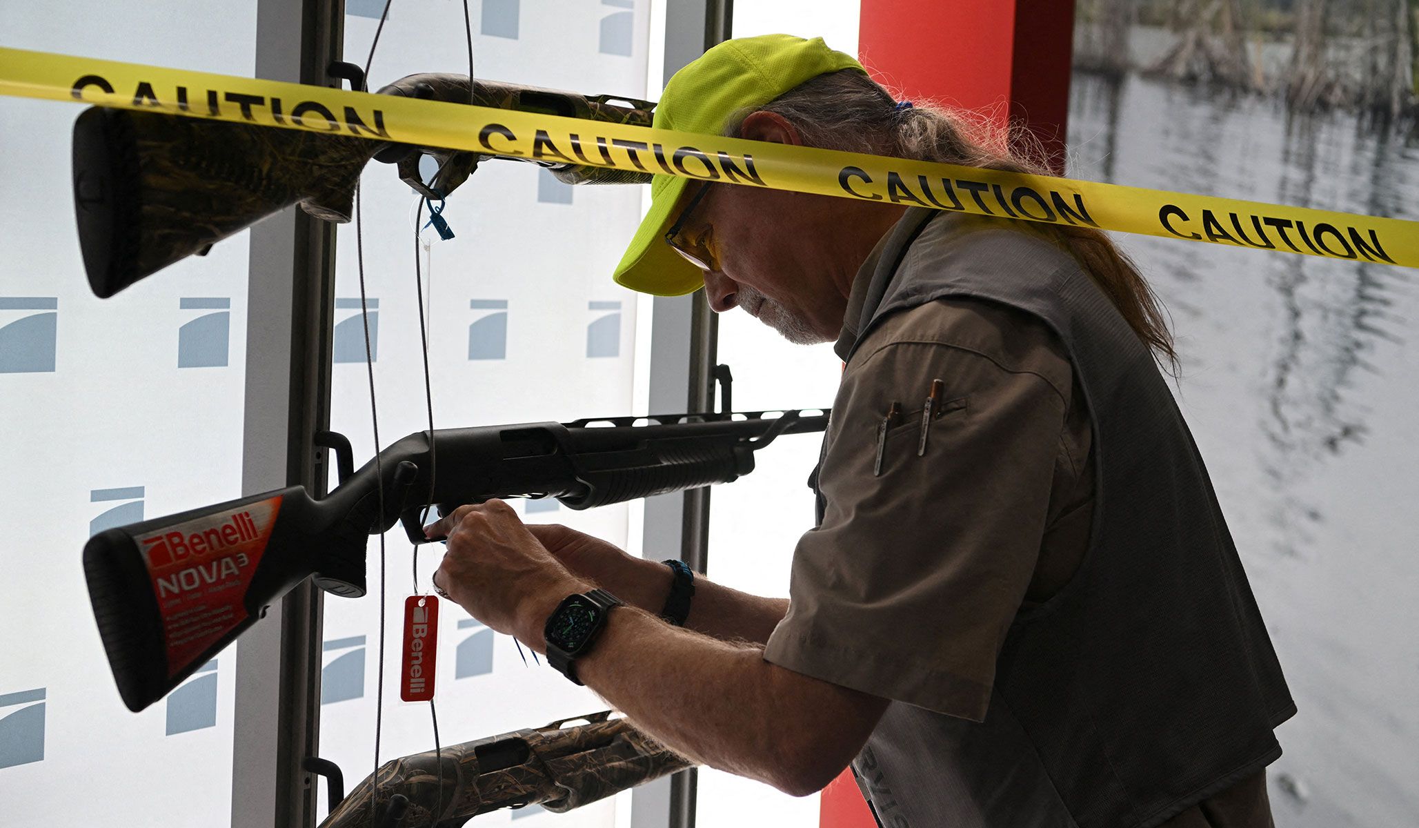 An NRA firearms examiner inspects a gun to ensure it is not fireable as exhibitors set up booths ahead of the National Rifle Association's annual meetings and exhibits in Houston, Texas, April 16, 2026.
