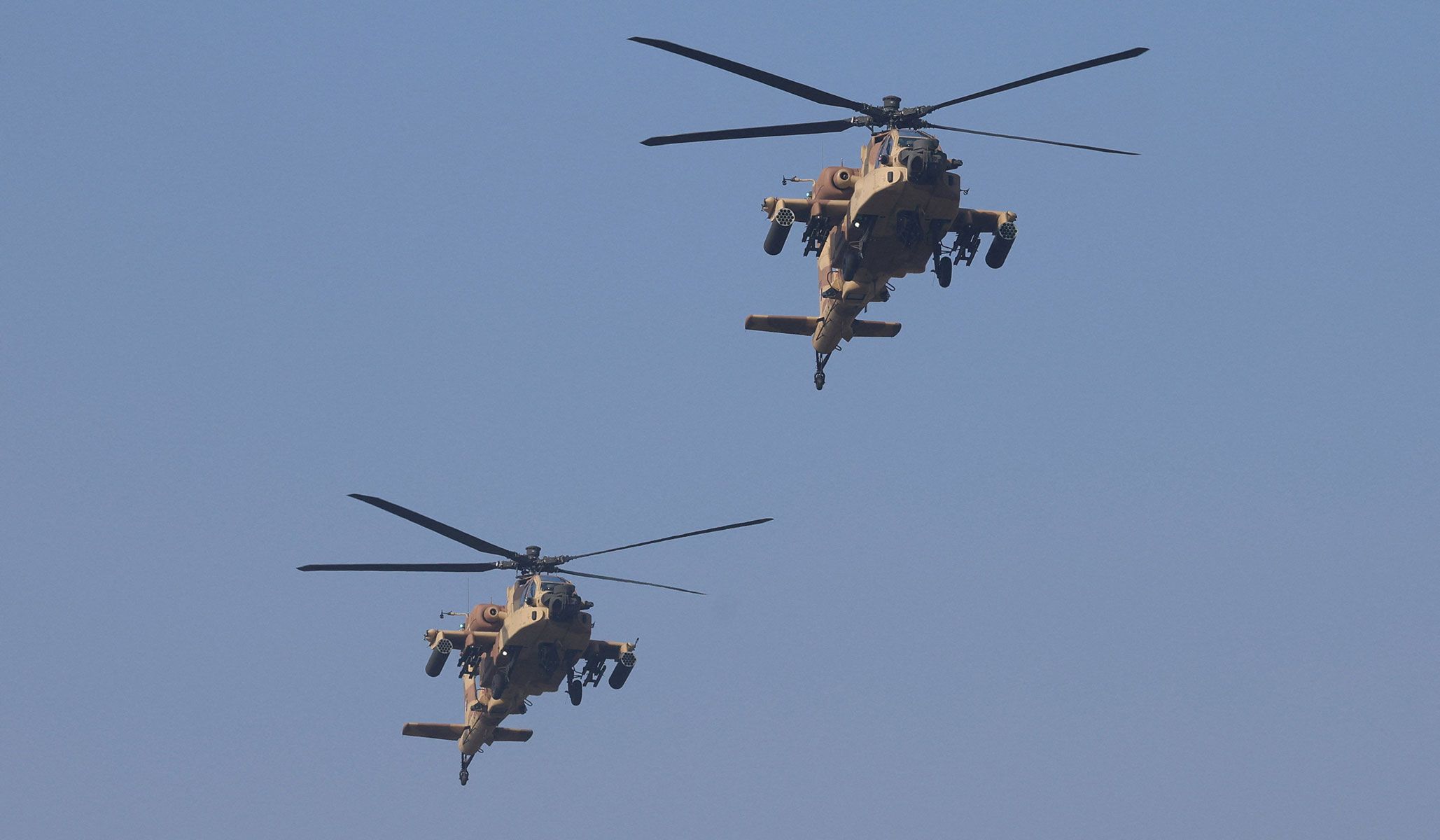 Indian Air Force Apache helicopters fly during the Republic Day parade in New Delhi, India, January 26, 2026.