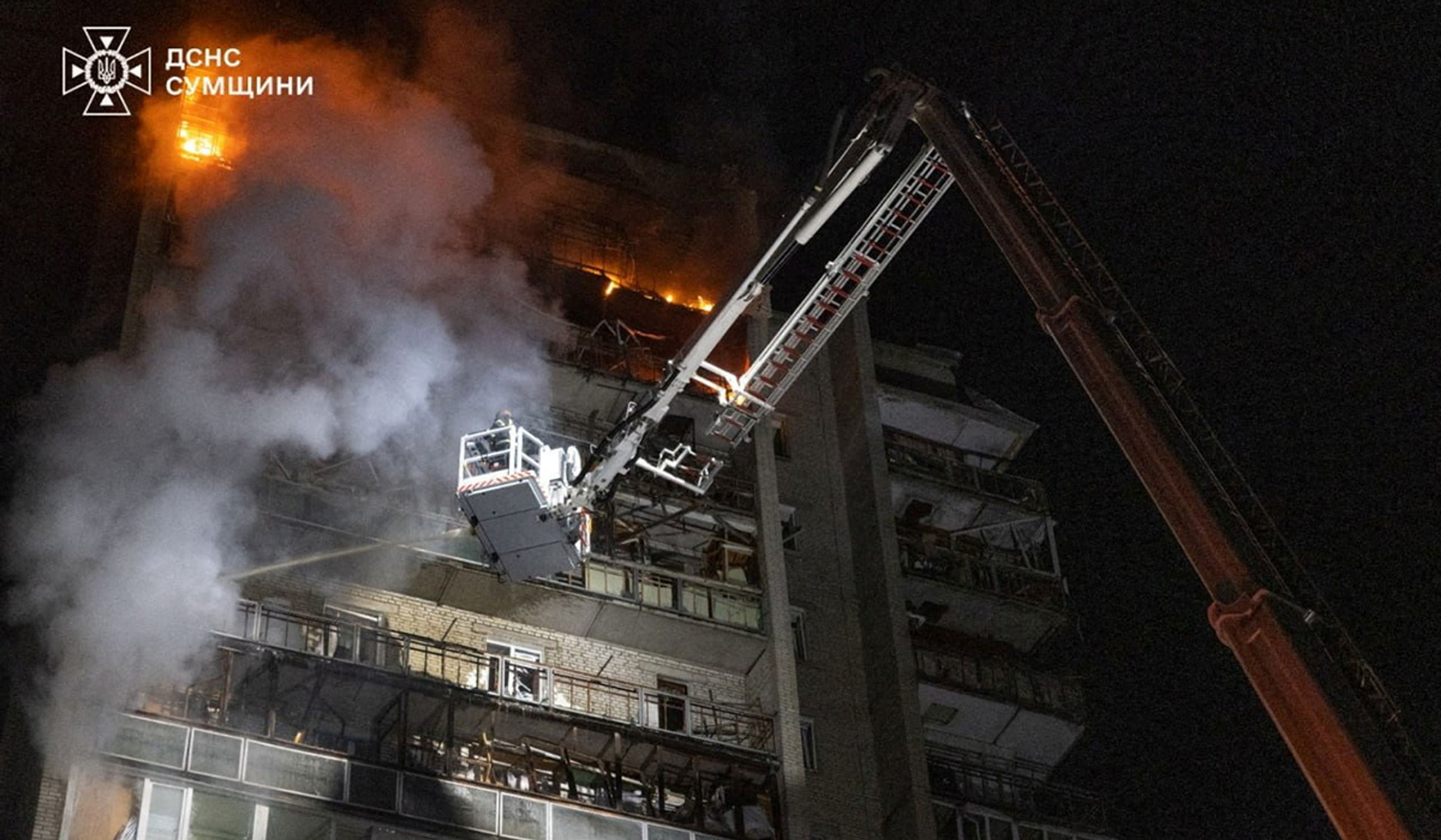 Firefighters work to extinguish a fire at an apartment building hit by a Russian drone strike in Sumy, Ukraine, in a handout picture released April 4, 2026.