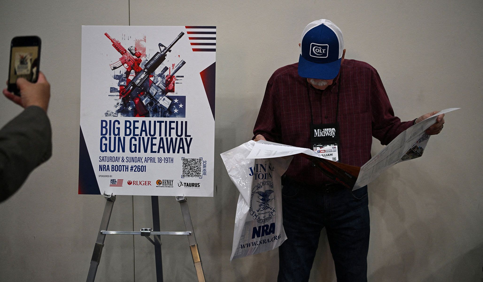 People attend the National Rifle Association's annual meetings and exhibits in Houston, Texas, April 17, 2026.