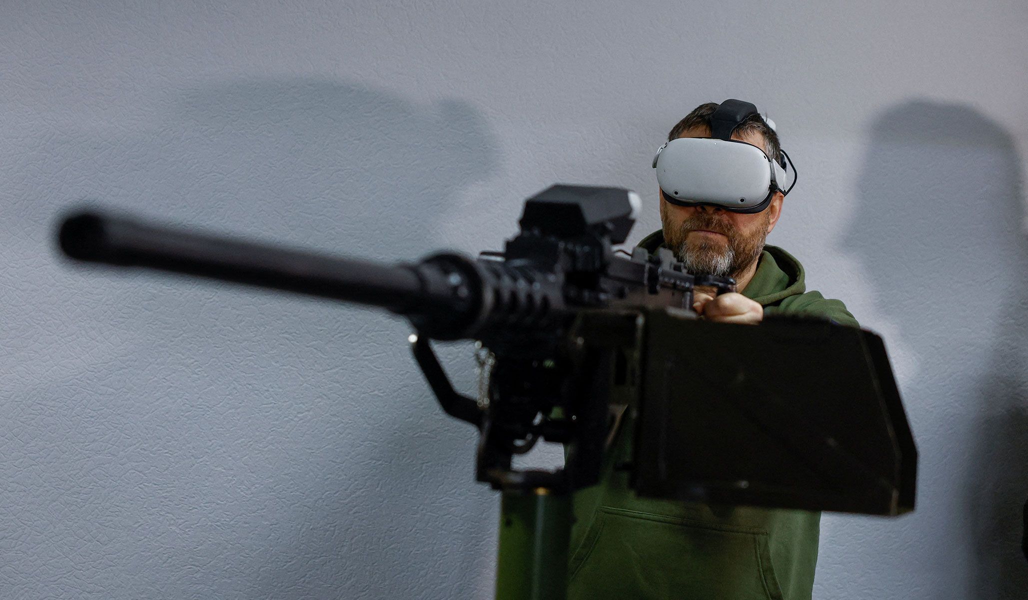 An employee of a private security company uses a simulator to train to shoot down drones with a machine gun in an undisclosed location in Ukraine April 8, 2026.