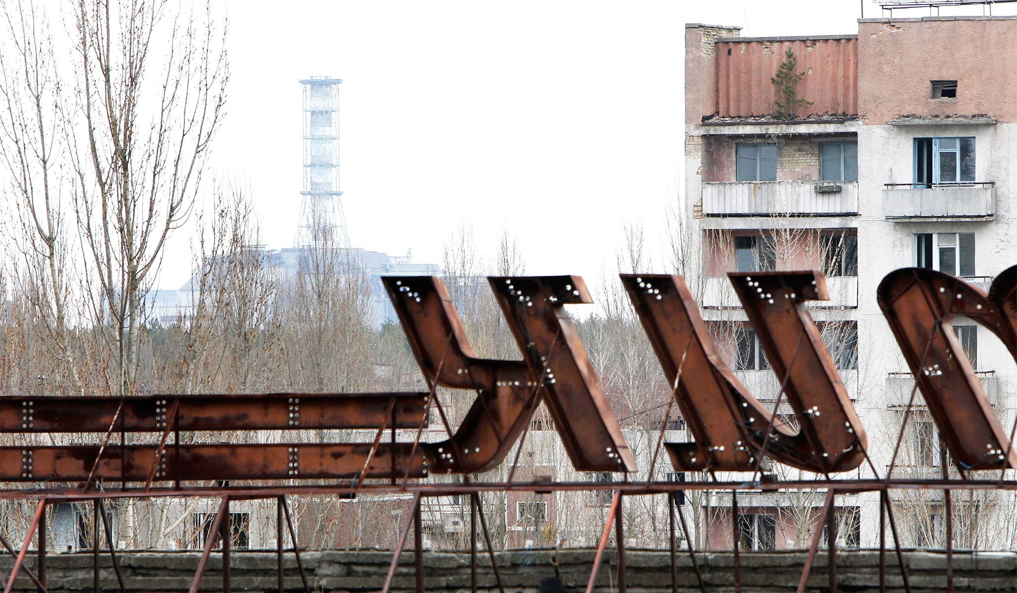 The abandoned city of Pripyat, with the sarcophagus covering the damaged fourth reactor at the Chernobyl nuclear power plant in the distance, March 31, 2011.