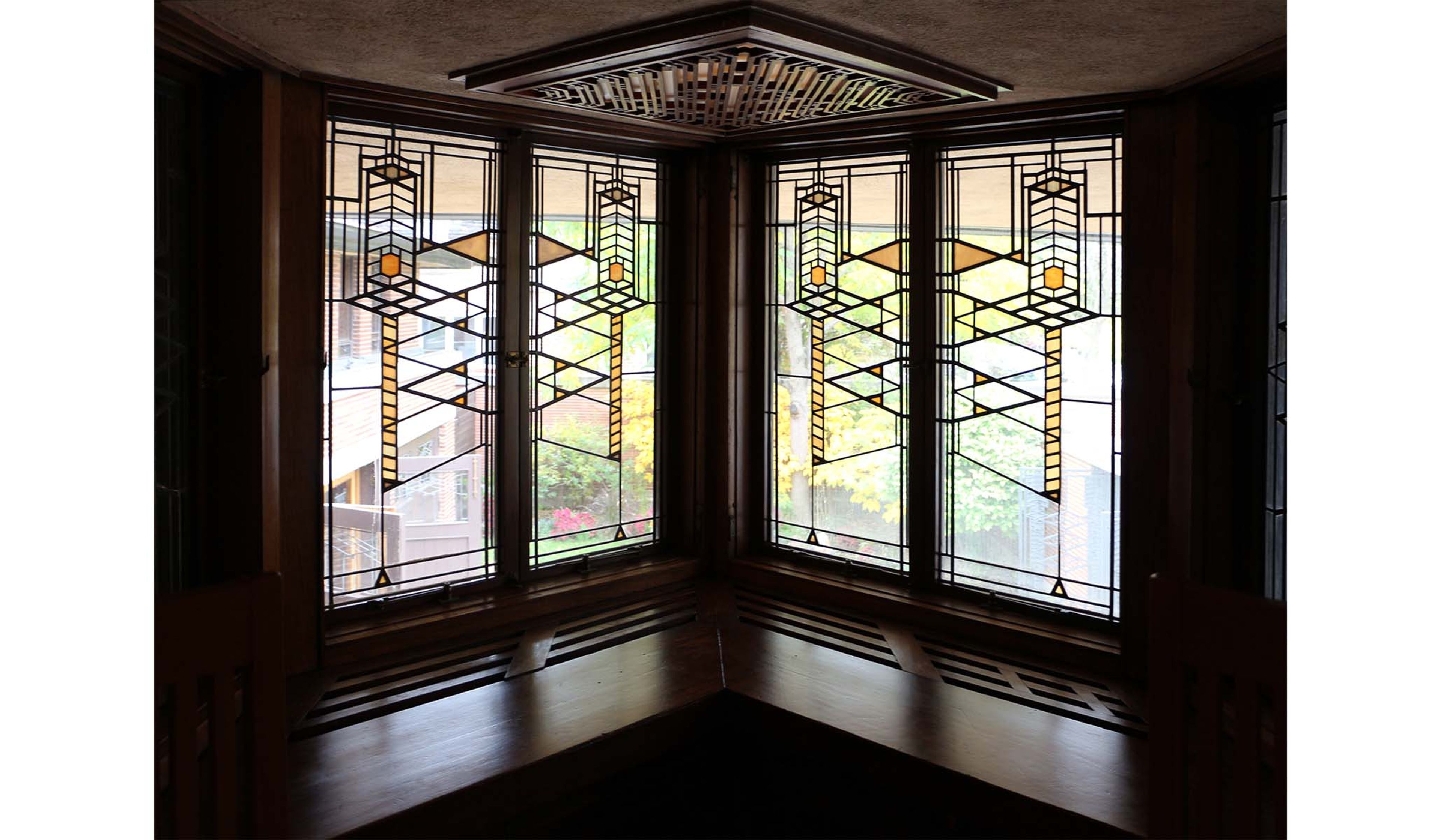 Wright used lots of stained glass in his houses, usually with earth colors rather than vibrant reds and blues. He thought this was more American.