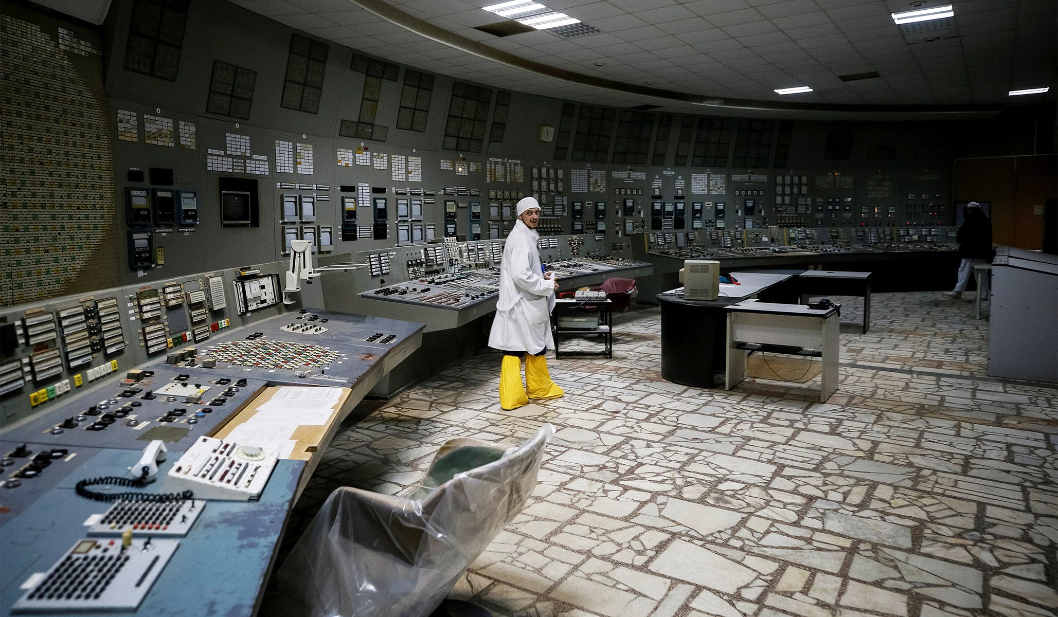 An employee at the control center of the stopped third reactor at the Chernobyl nuclear power plant in Chernobyl, Ukraine, April 20, 2018.