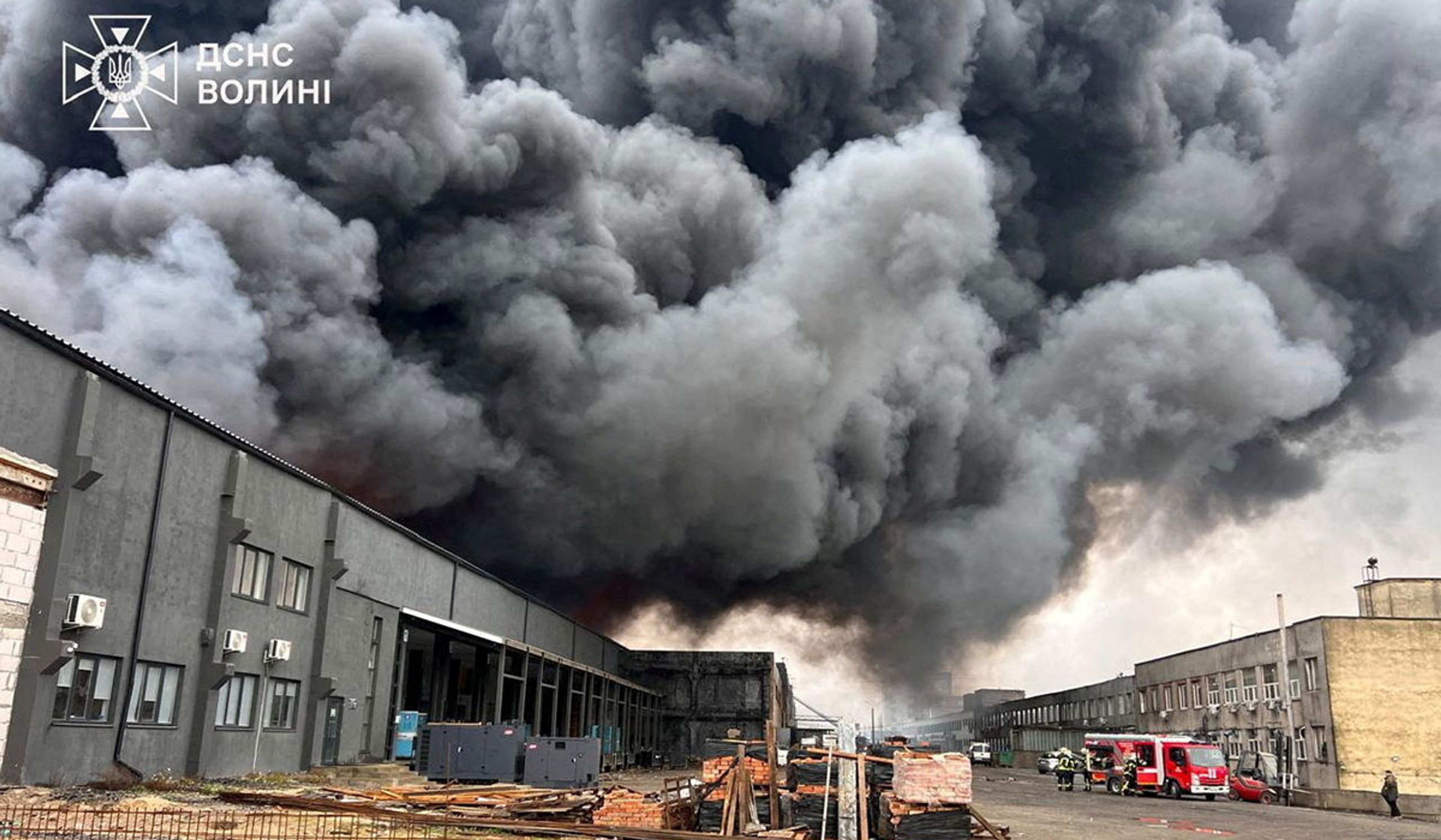 Firefighters work at the site of a Russian drone strike in Lutsk, Ukraine, April 1, 2026.