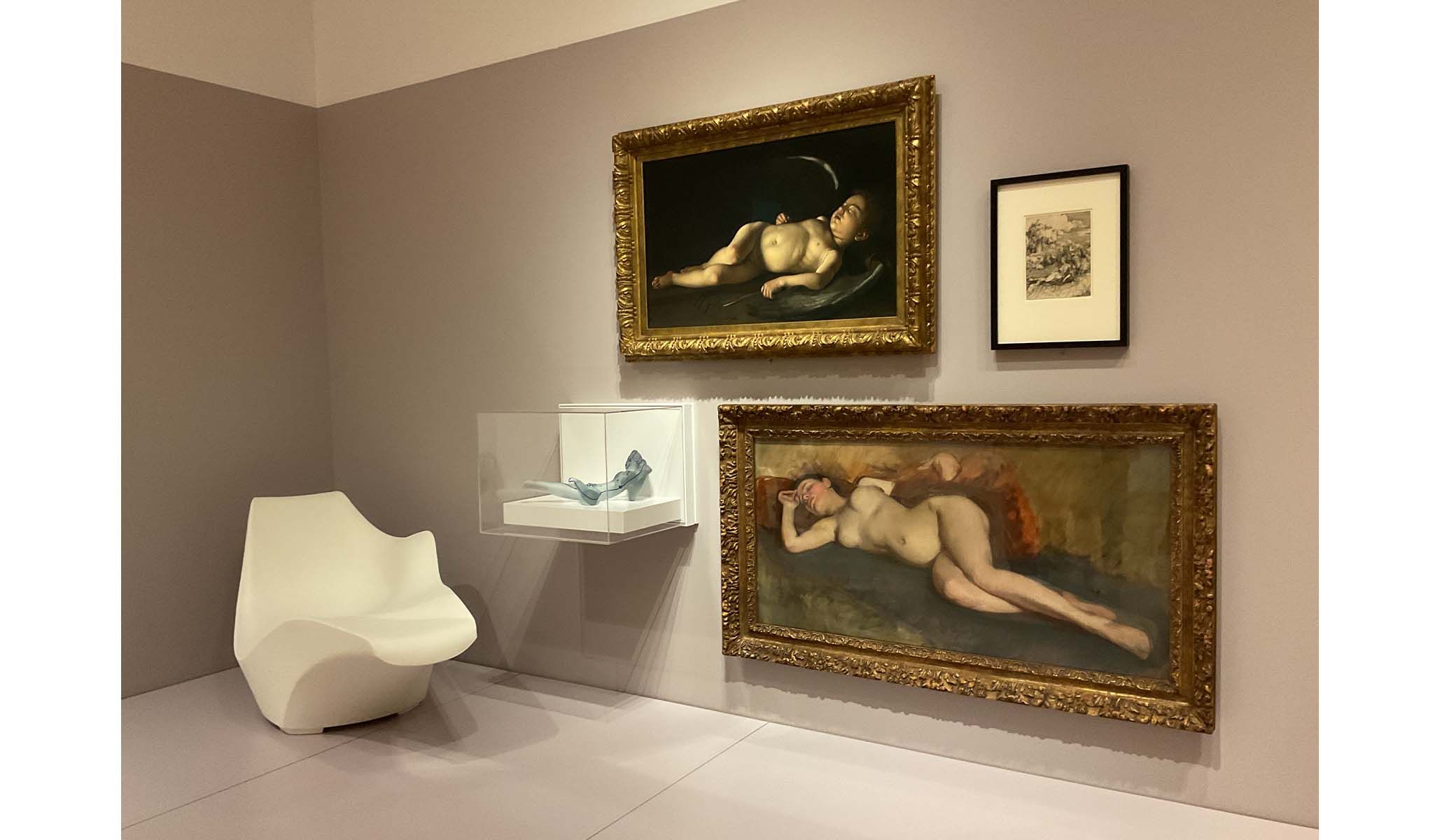 Installation view of nudes paired with Modernist design objects.