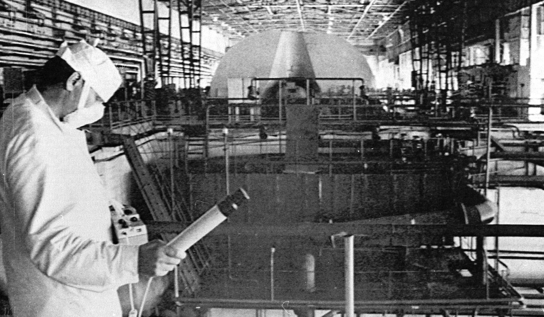 A worker at the Chernobyl nuclear power plant checks the radiation level in the engine room of the first and second power units, June 5, 1986.