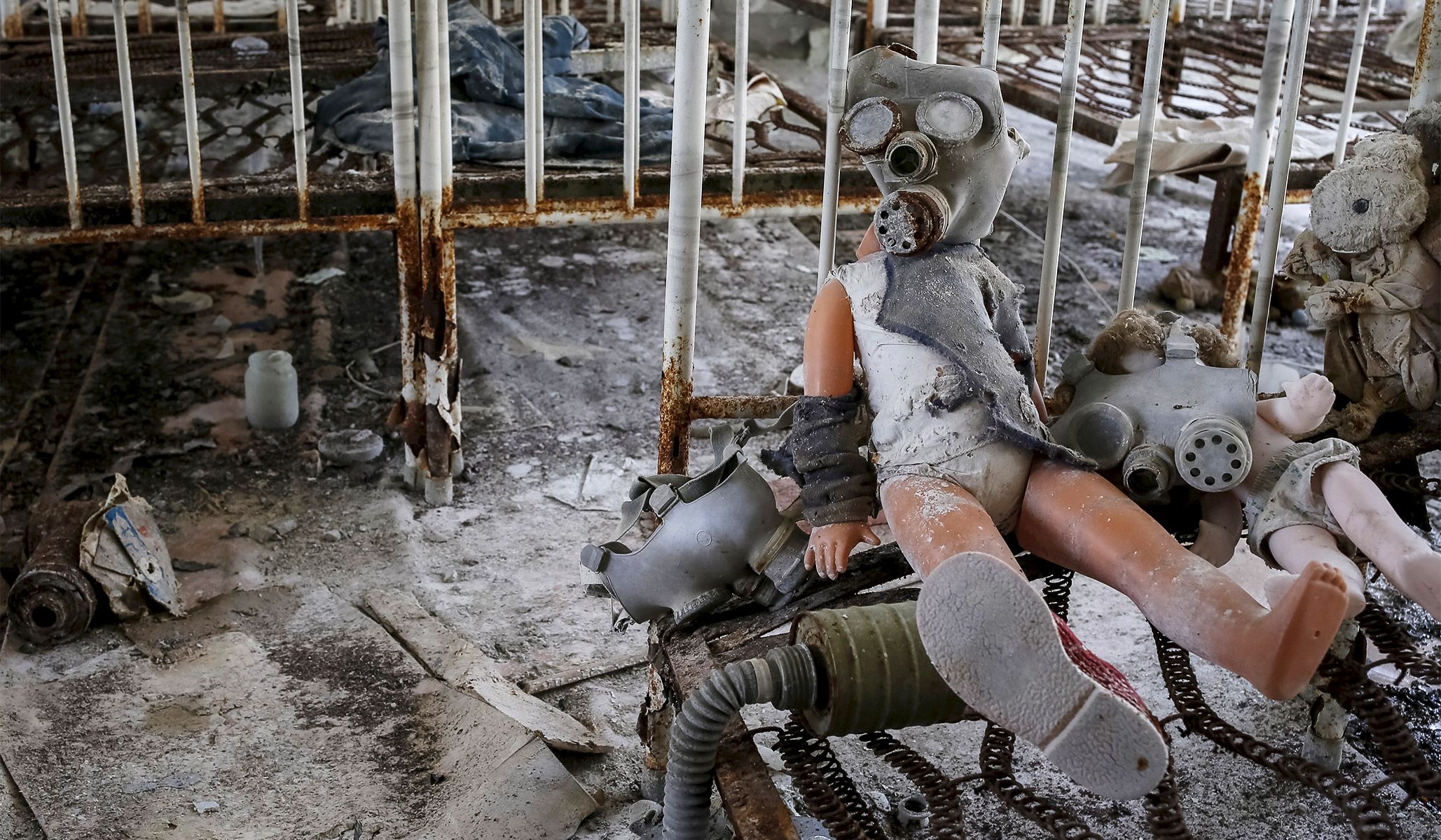 A doll in a children's gas mask among beds at a kindergarten in the abandoned city of Pripyat near the Chernobyl nuclear power plant in Ukraine, March 28, 2016.