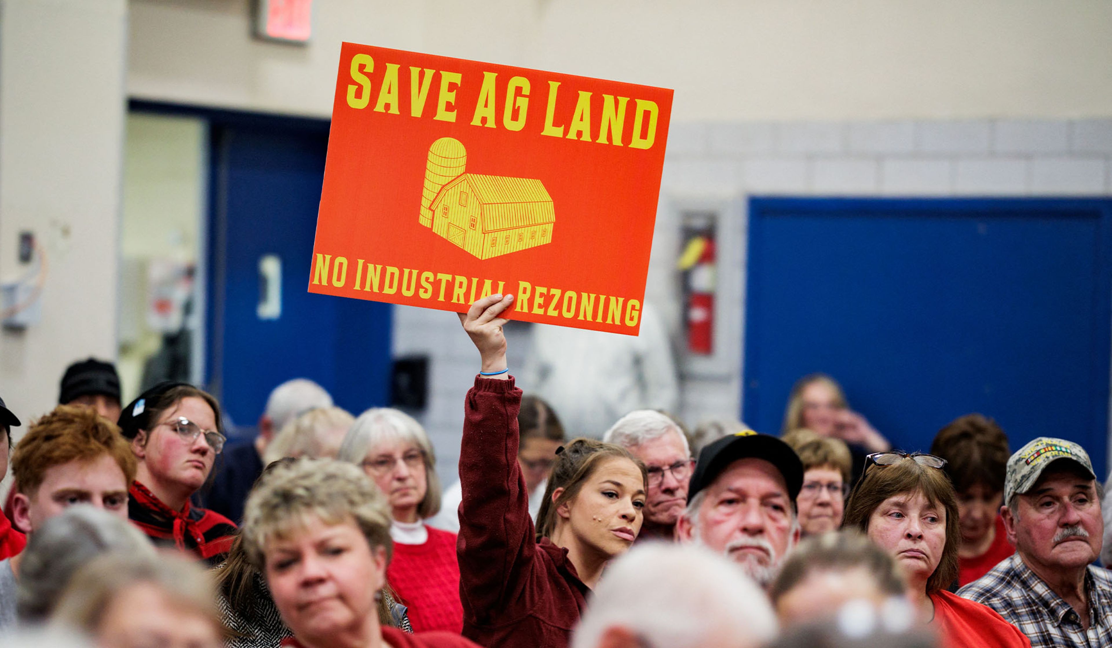 A resident holds a sign opposing a proposed data-center rezoning in Danville, Pa., November 19, 2025.
