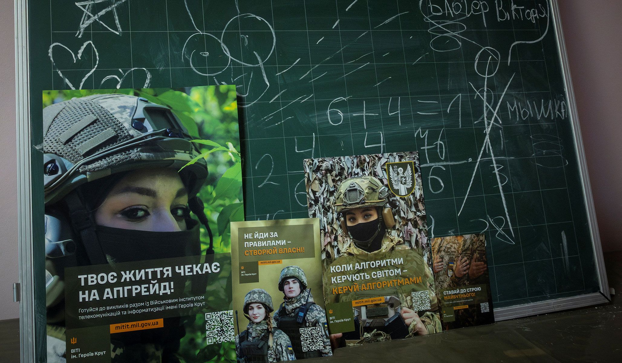 Army recruitment posters on a blackboard in an underground shelter that doubles as classroom in a school in Chernihiv, Ukraine November 25, 2025.