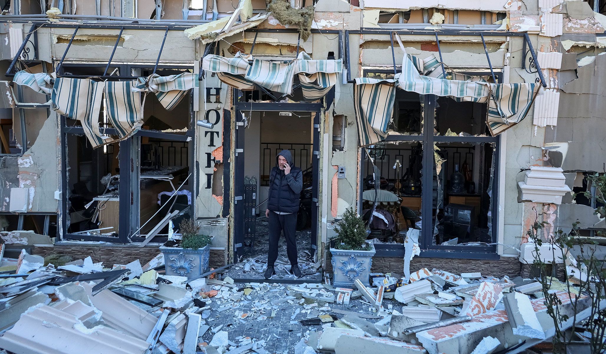 A man stands in a hotel hit by a Russian drone strike in Odesa, Ukraine, April 27, 2026.