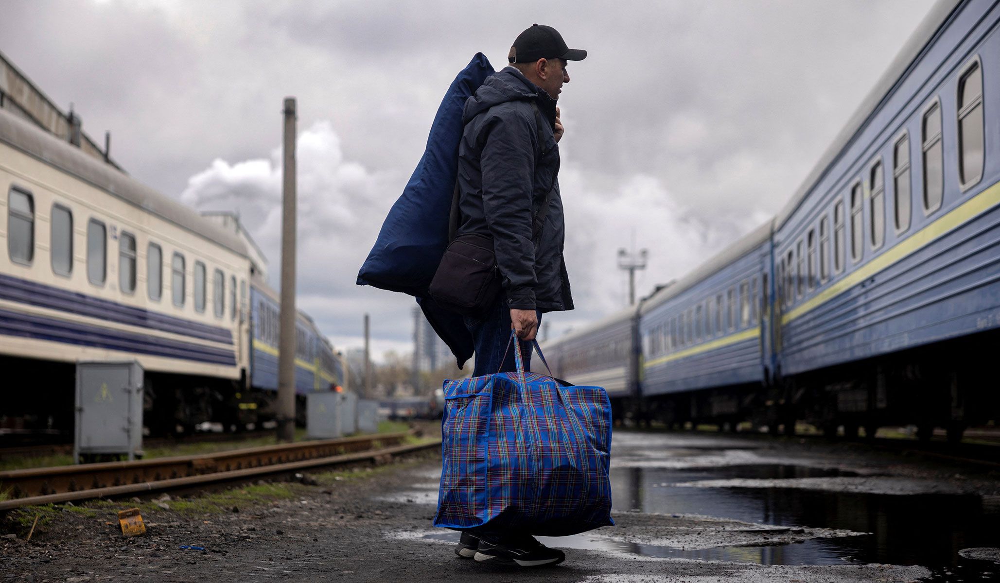 A man stands outside a train during an exercise conducted by Ukrainian Railways (Ukrzaliznytsia) simulating passenger evacuation following repeated Russian drone attacks on the rail system in Kyiv, Ukraine, April 9, 2026.