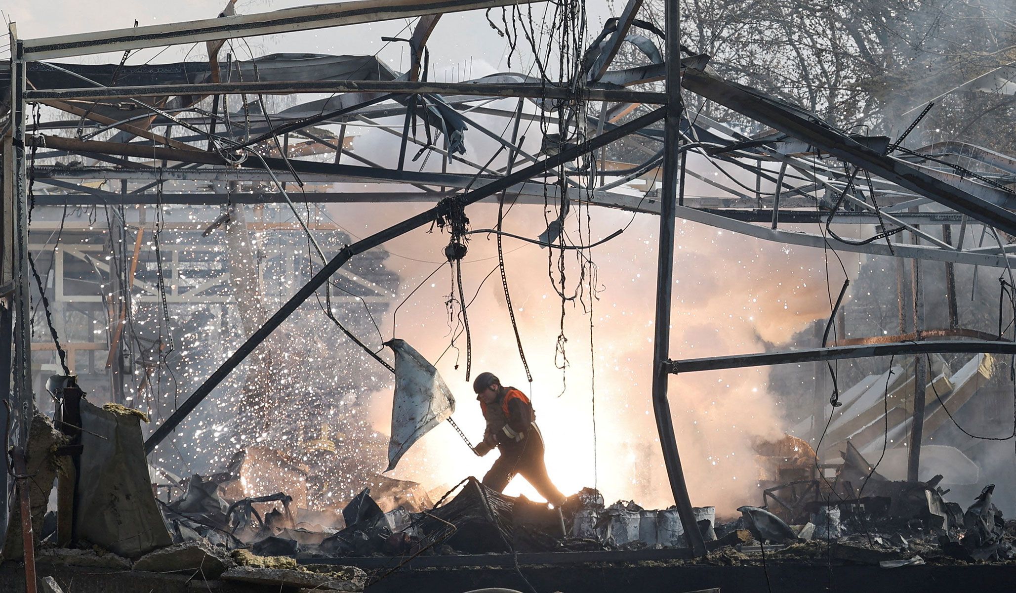 A firefighter inspects a compound of a private enterprise hit by a Russian missile strike in Chernihiv, Ukraine, April 2, 2026.
