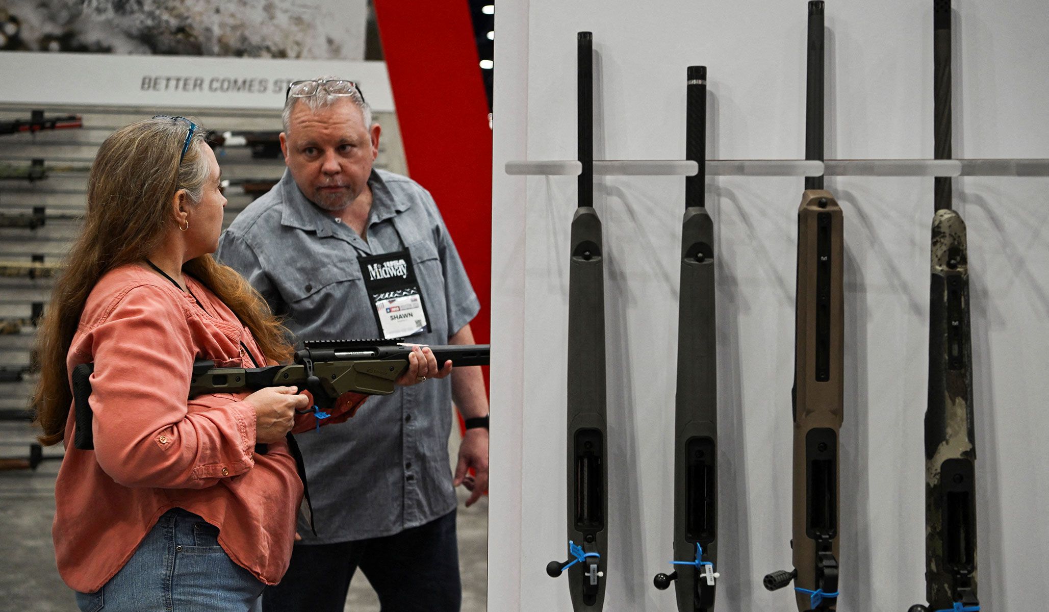 Attendees at an exhibitor booth at the National Rifle Association's annual meetings and exhibits in Houston, Texas, April 18, 2026.