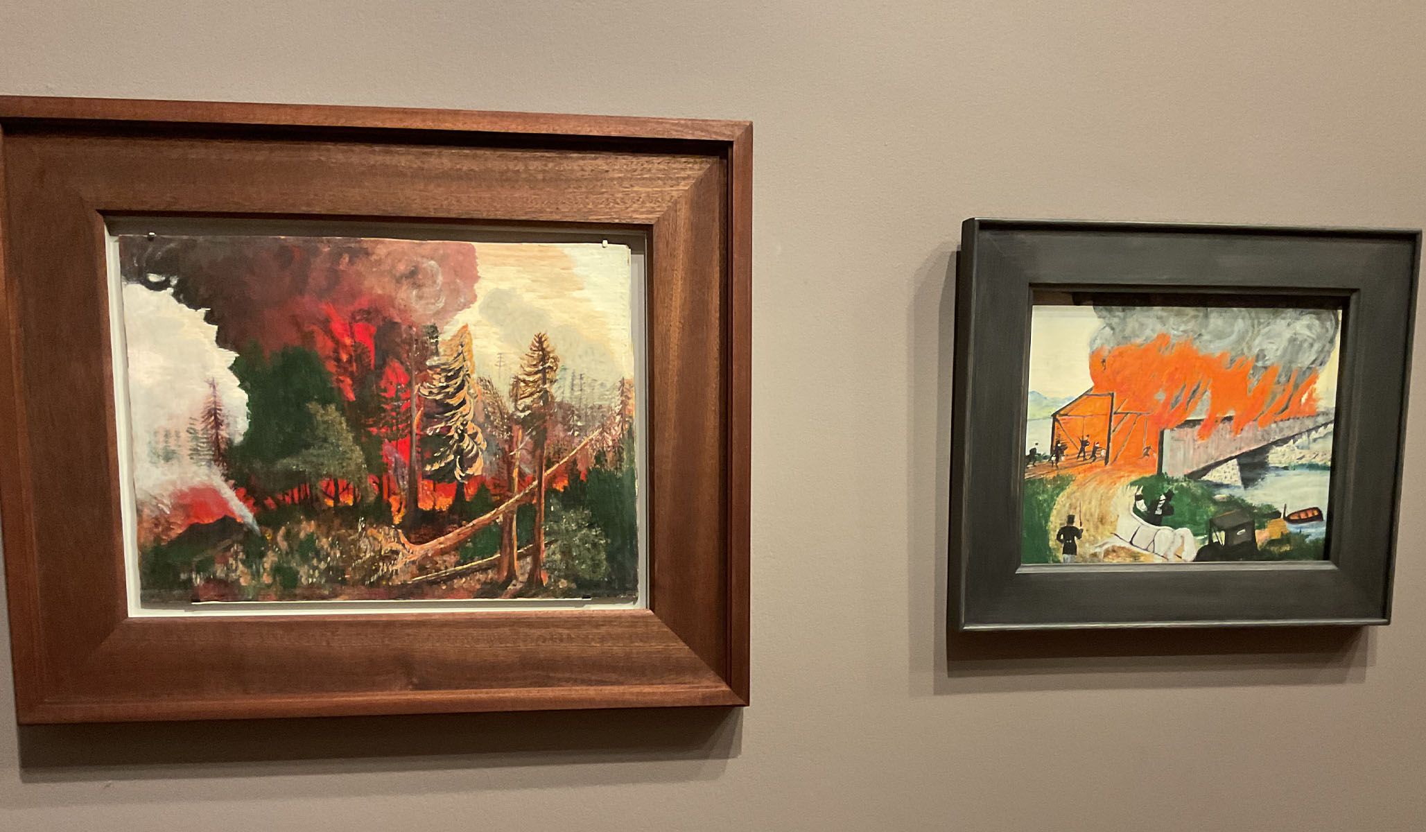 Gallery view of two fire scenes by Grandma Moses.
