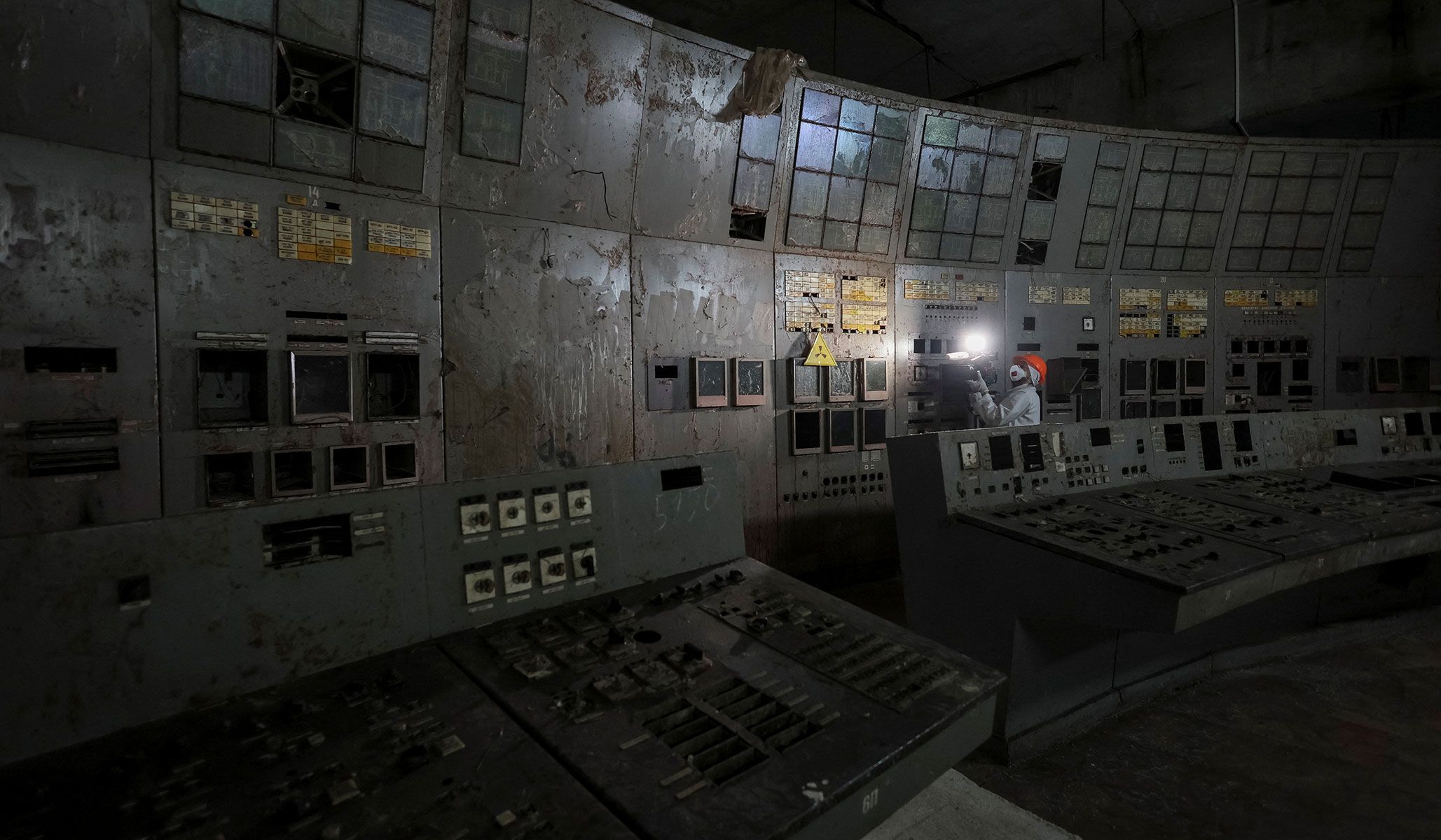 A journalist visits a control center of the damaged fourth reactor at the Chernobyl nuclear power plant in Kyiv Region, Ukraine, April 22, 2026.