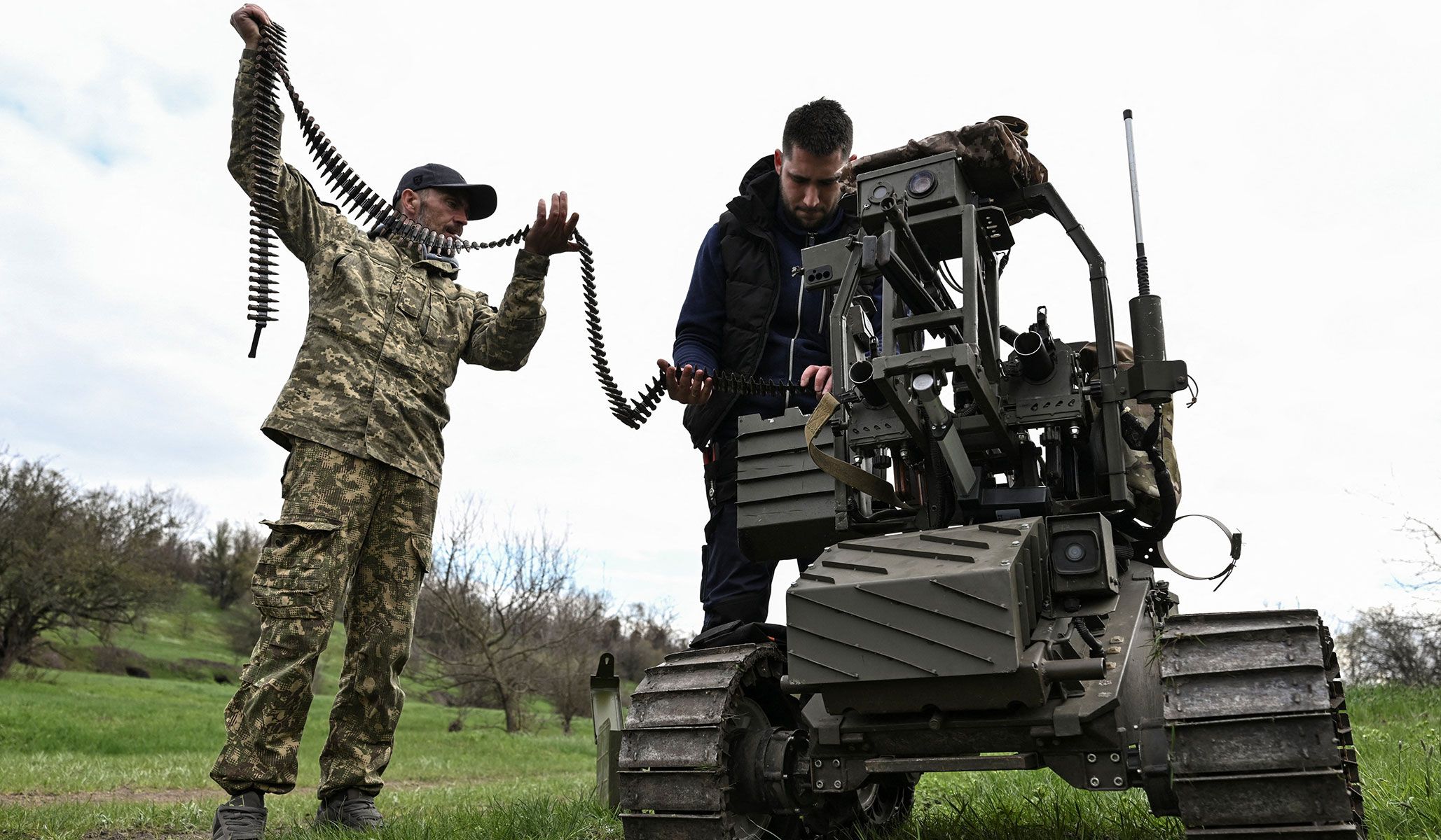 Ukrainian servicemen load ammunition into an unmanned ground vehicle before testing it at a training ground near a front line in Zaporizhzhia Region, Ukraine, April 10, 2026.