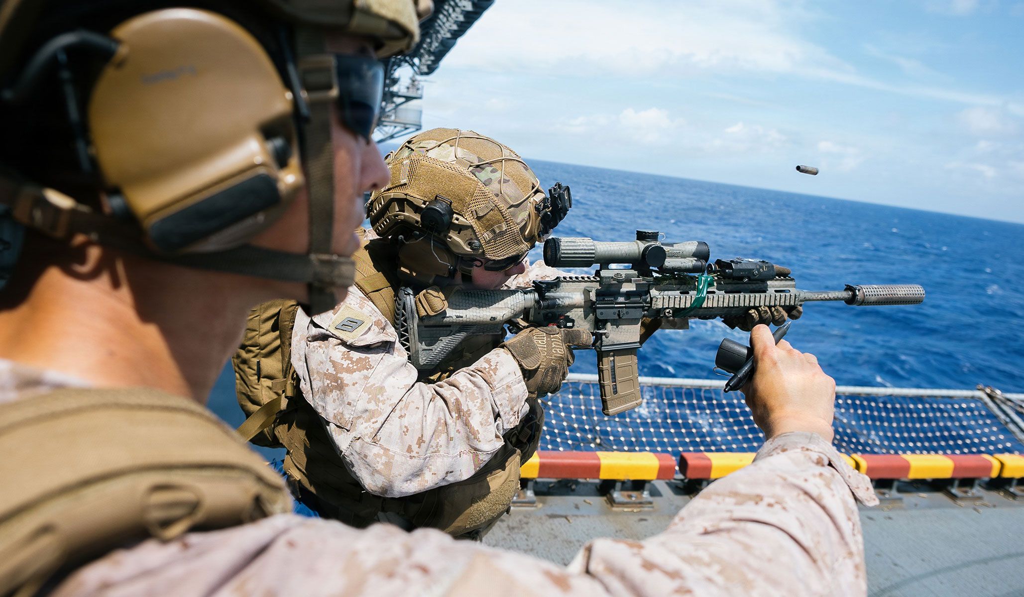 U.S. Navy Hospital Corpsman Drew Hensley with Weapons Company, Battalion Landing Team 3/5, 11th Marine Expeditionary Unit, fires an M27 infantry automatic rifle during marksmanship training aboard the Wasp-class amphibious assault ship USS <i>Boxer</i> (LHD-4), under way in the Pacific Ocean, April 23, 2026.