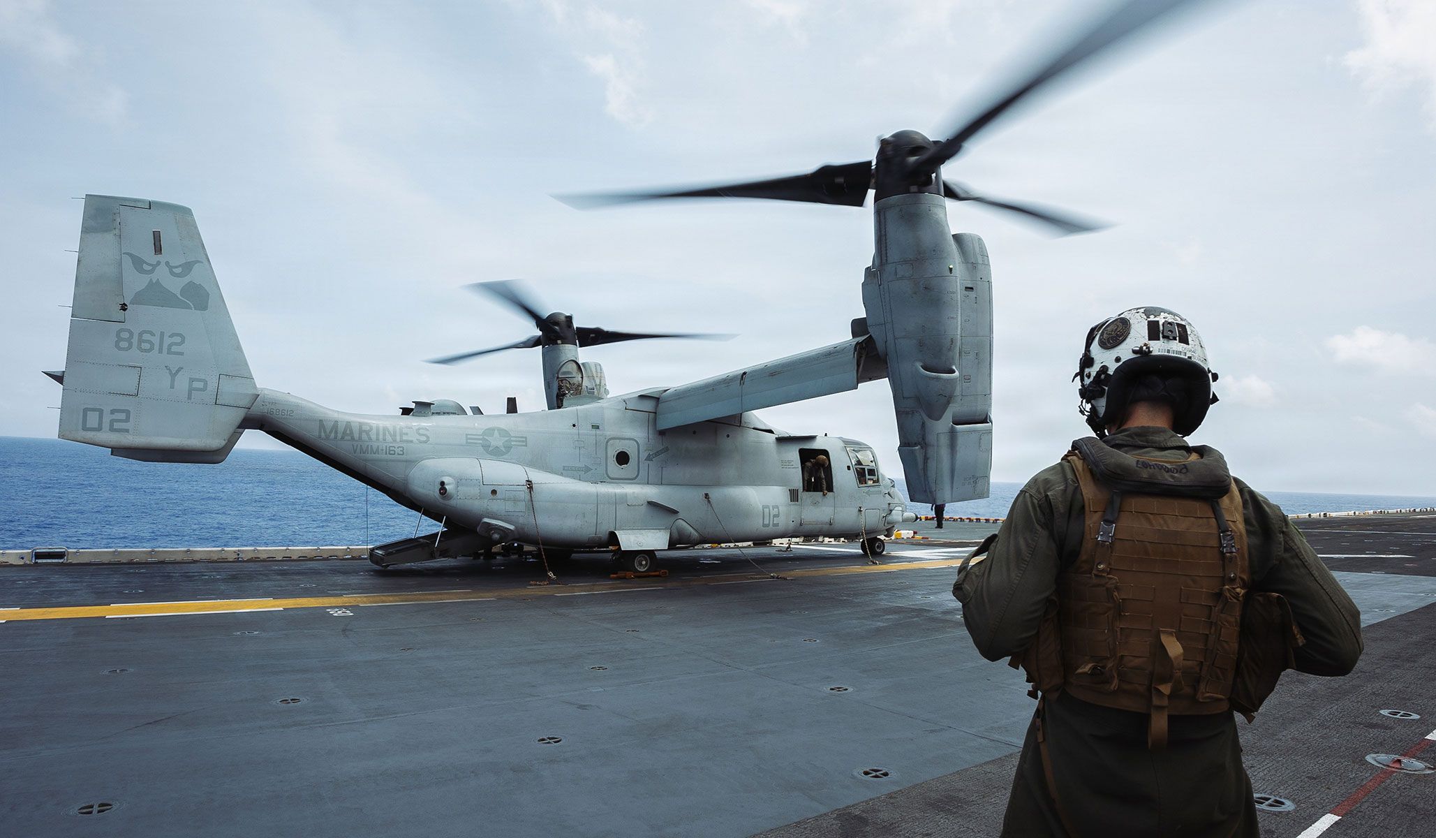 A U.S. Marine Corps MV-22B Osprey assigned to the “Evil Eyes” of Marine Medium Tiltrotor Squadron VMM-163 (Reinforced), 11th Marine Expeditionary Unit, prepares to depart the Wasp-class amphibious assault ship USS <i>Boxer</i> (LHD-4), under way in the Pacific Ocean, April 18, 2026.