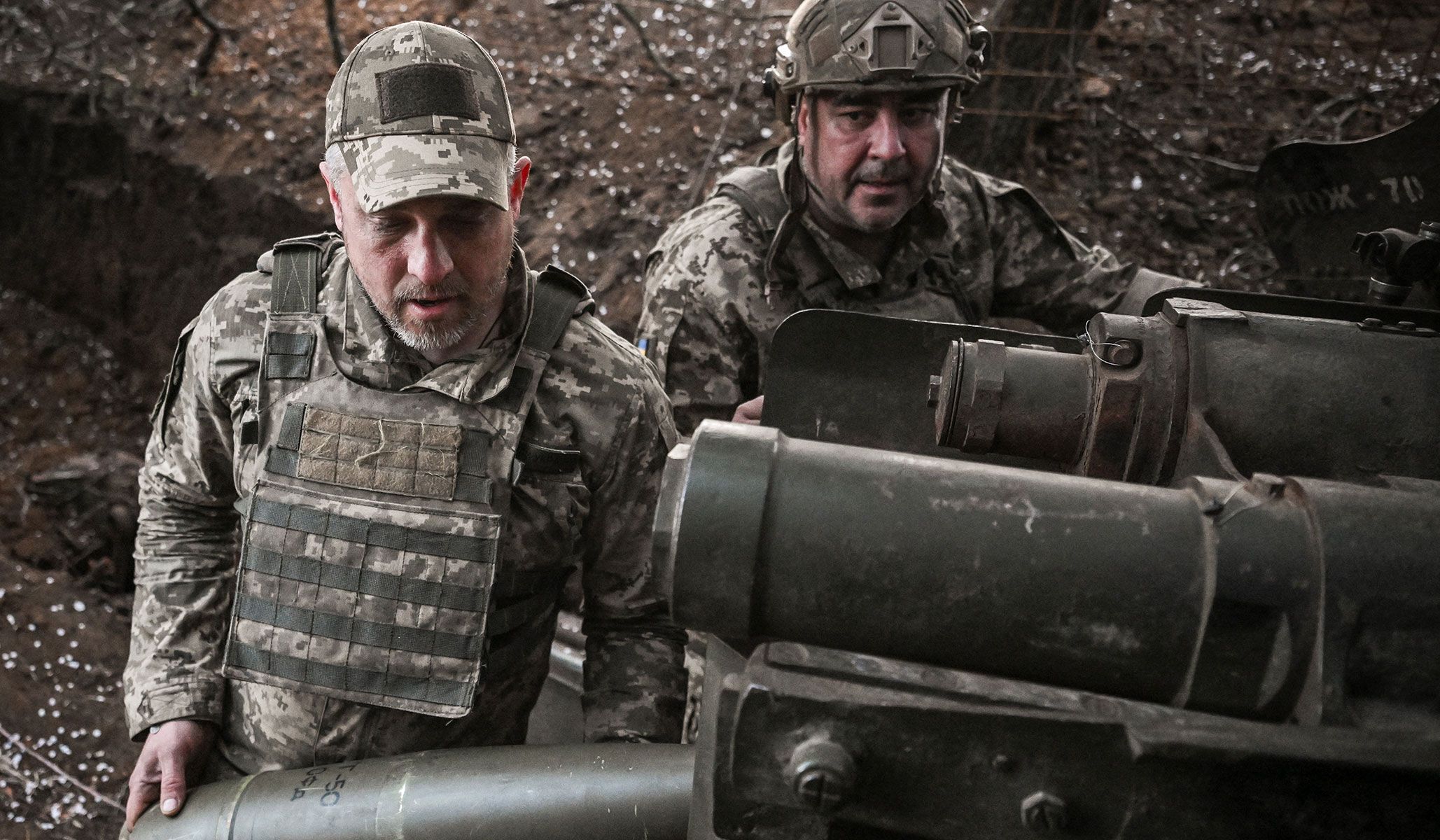 Ukrainian service members of the 260th Zaporizhzhia Separate Territorial Defence Brigade of the Ukrainian Armed Forces load a 152-mm shell for a D‑20 howitzer before firing towards Russian troops at a frontline position in Zaporizhzhia Region, Ukraine, April 9, 2026.
