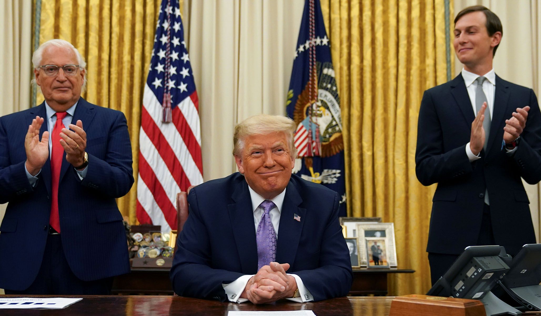Then–U.S. Ambassador to Israel David Melech Friedman and Jared Kushner applaud after President Donald Trump announced a peace deal between Israel and the UAE, August 13, 2020.