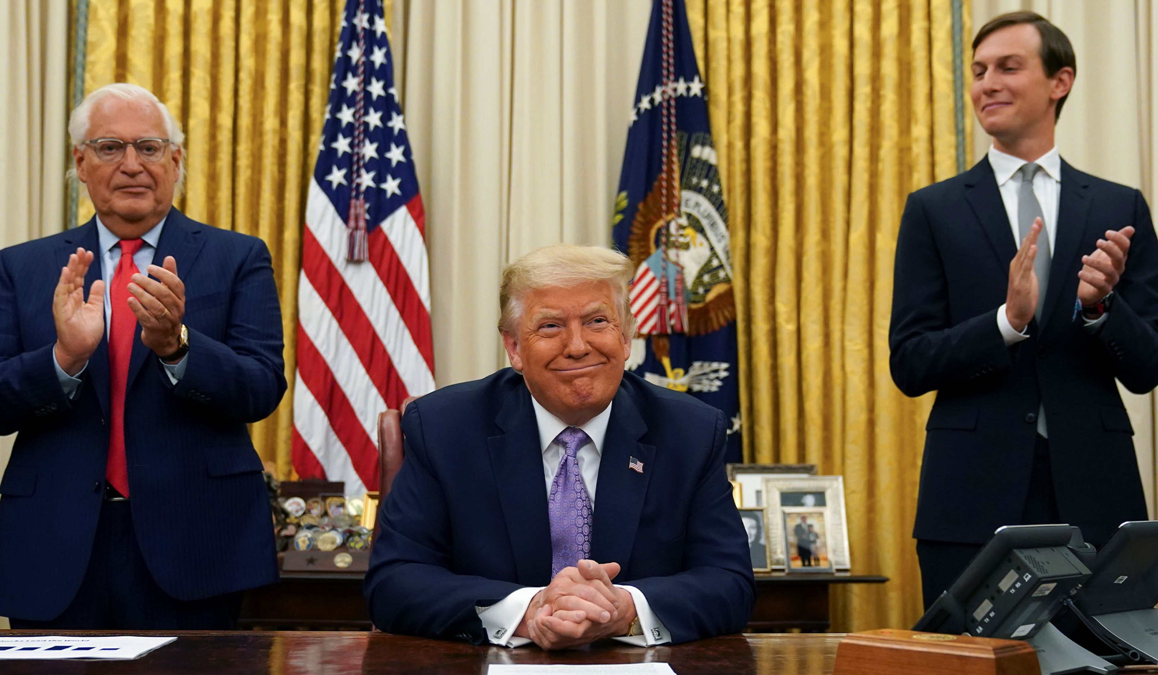 Then–U.S. Ambassador to Israel David Melech Friedman and Jared Kushner applaud after President Donald Trump announced a peace deal between Israel and the UAE, August 13, 2020.