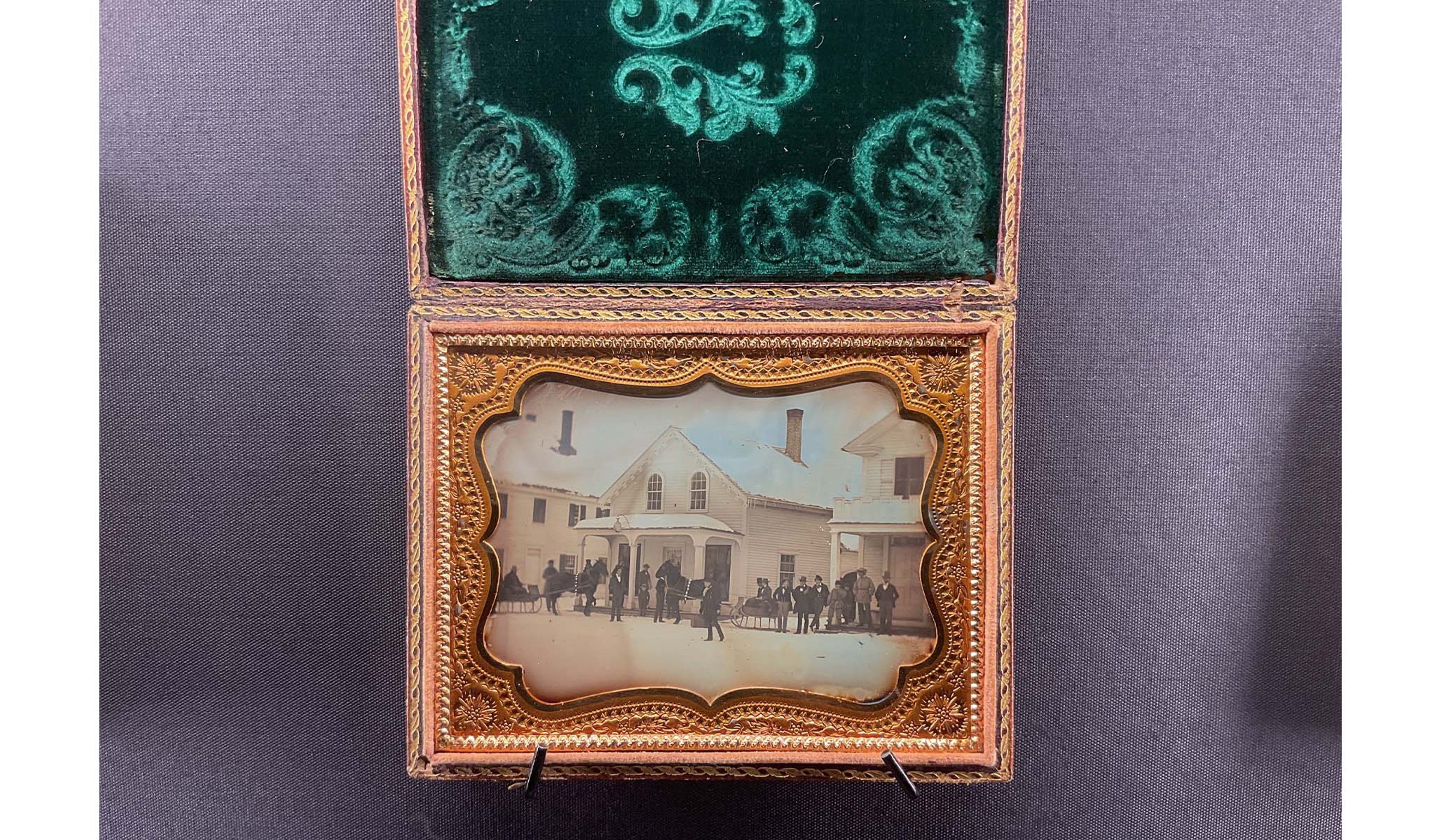 An example of a daguerreotype case with a velvet lining and frame.