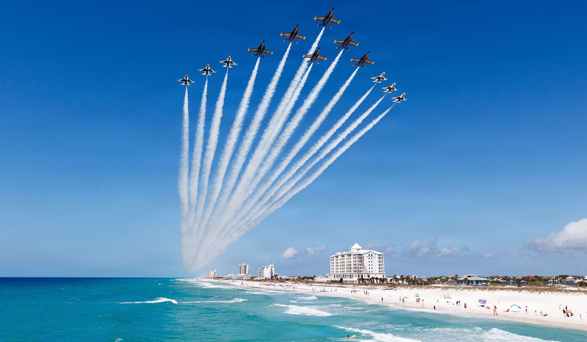 The U.S. Navy Flight Demonstration Squadron “Blue Angels” and U.S. Air Force Air Demonstration Squadron “Thunderbirds” perform a rare Super Delta formation flyover of Pensacola Beach, Fla., April 14, 2026.