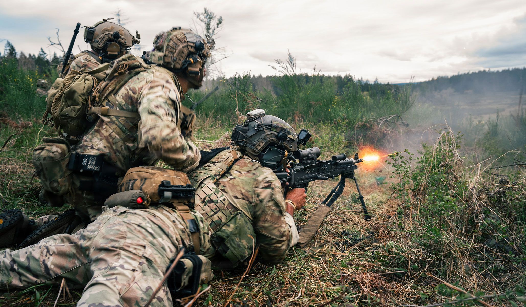 U.S. Army Green Berets assigned to First Special Forces Group (Airborne) fire downrange during a simulated ambush attack at Joint Base Lewis McChord, Wash., April 21, 2026.