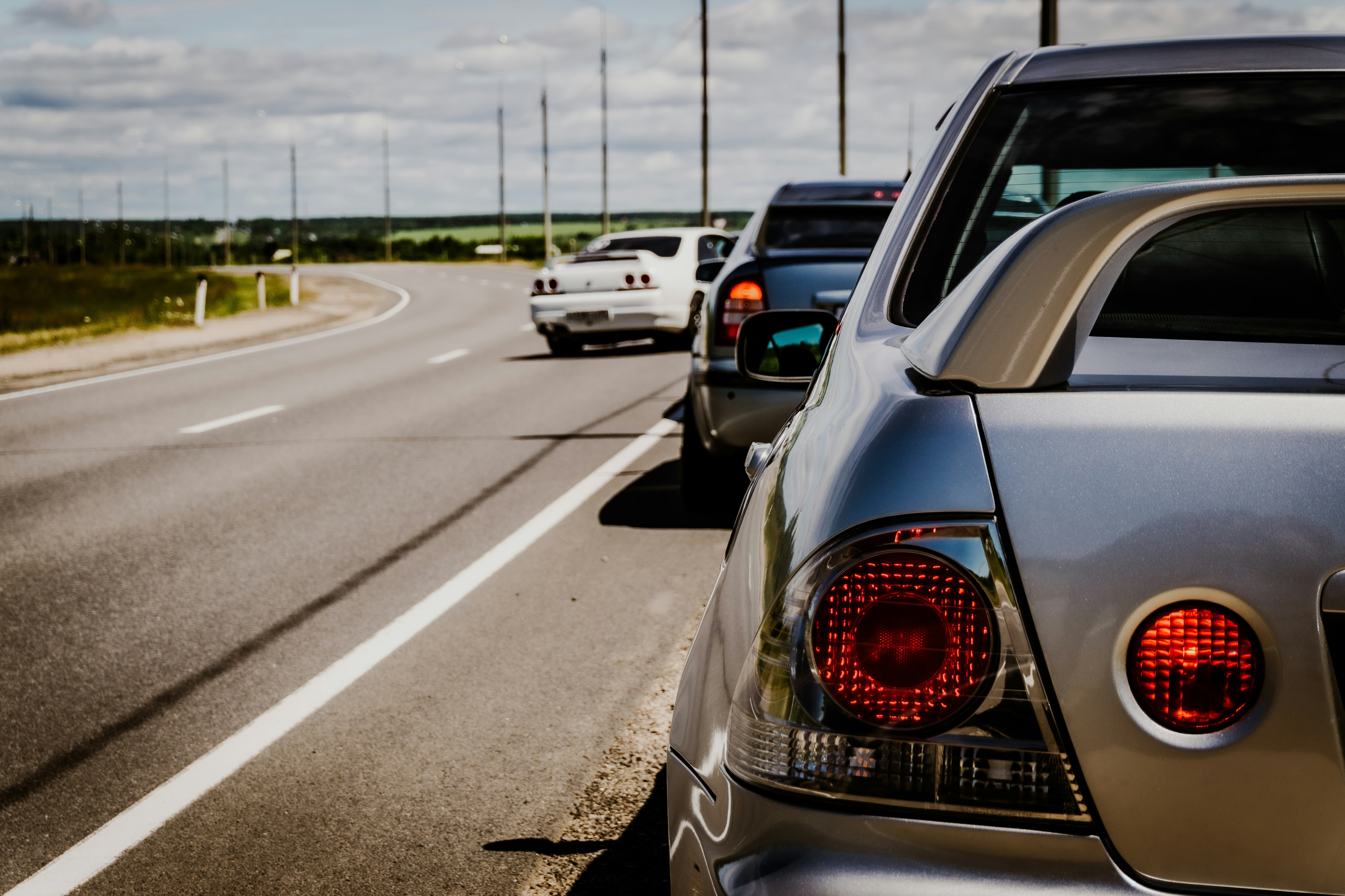 Image Cars stopped on the shoulder of a busy New Jersey highway, an unsafe location for a Lyft driver to drop off a passenger